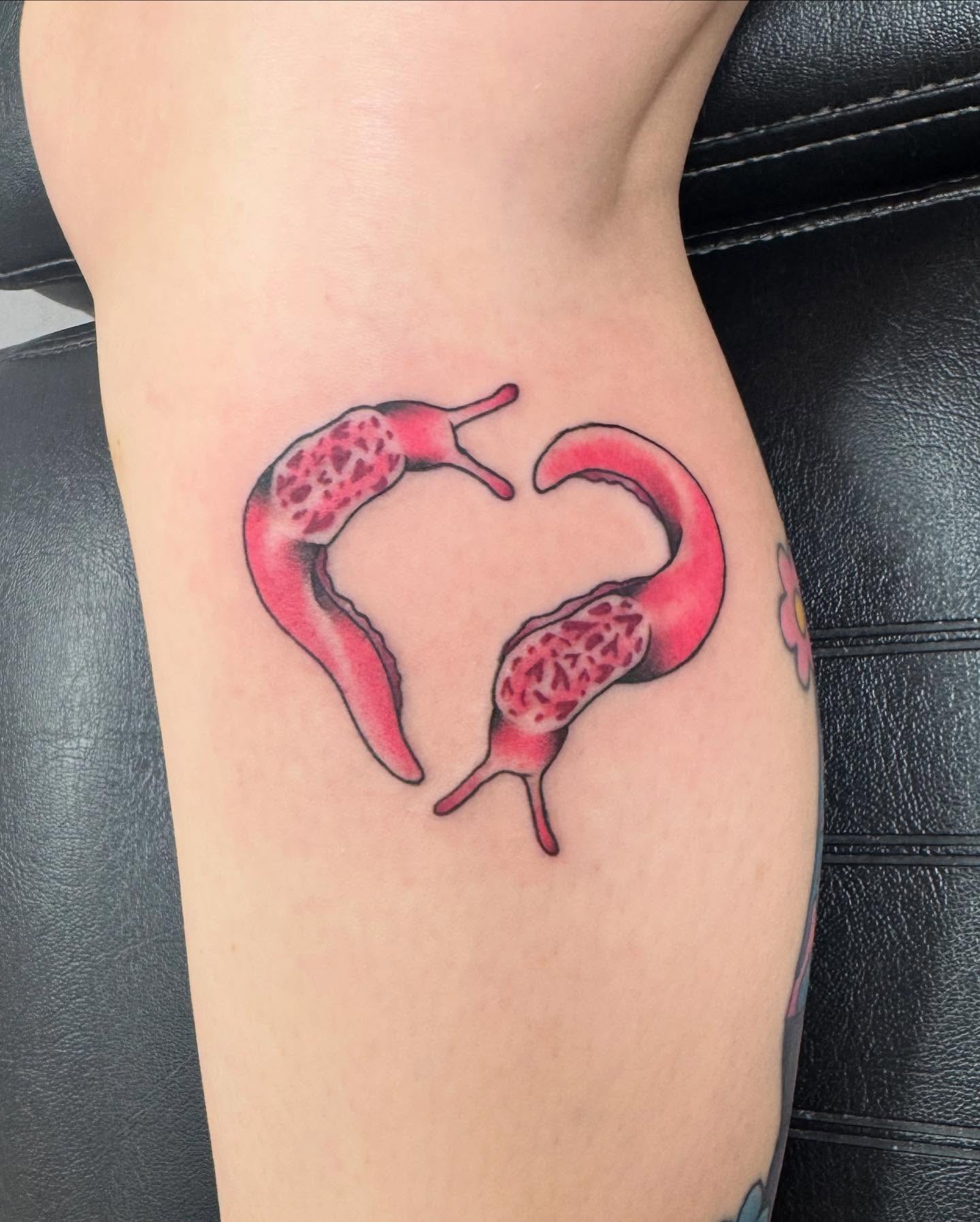 Snail heart realism tattoo on the forearm by McKenna Chalifoux