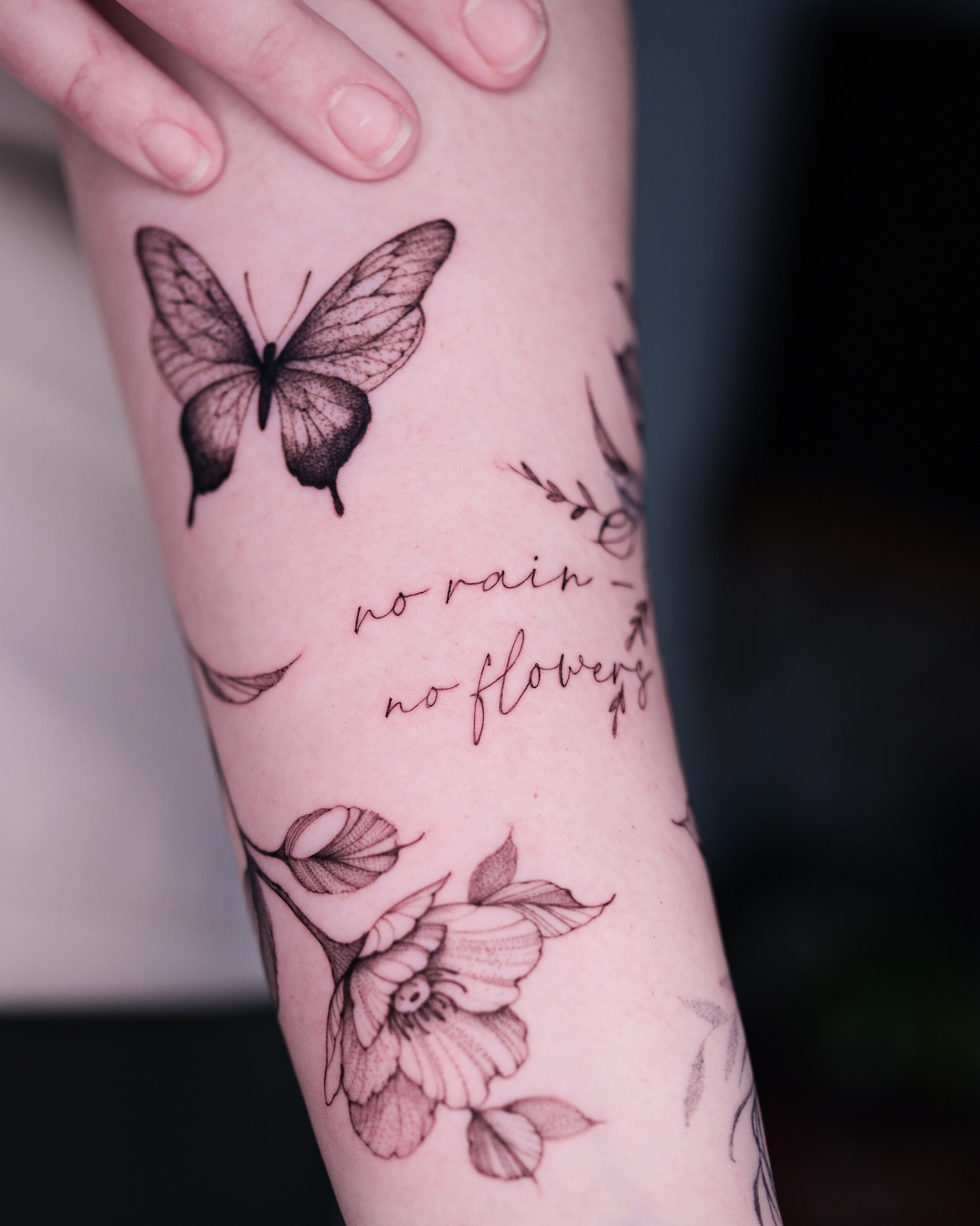 No rain - no flowers black and grey tattoo on the forearm by Tattoo artist in Boston