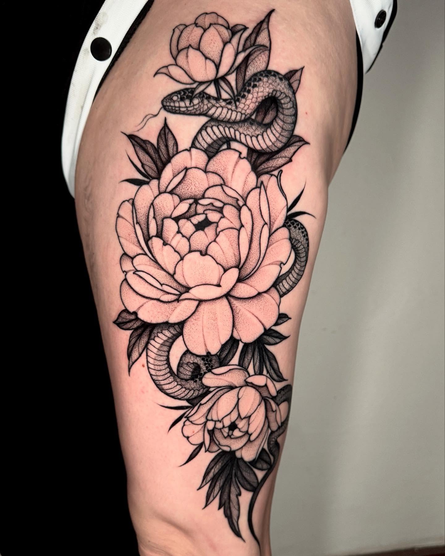 Snake and peony dotwork tattoo on the thigh by Lauren Llerandi