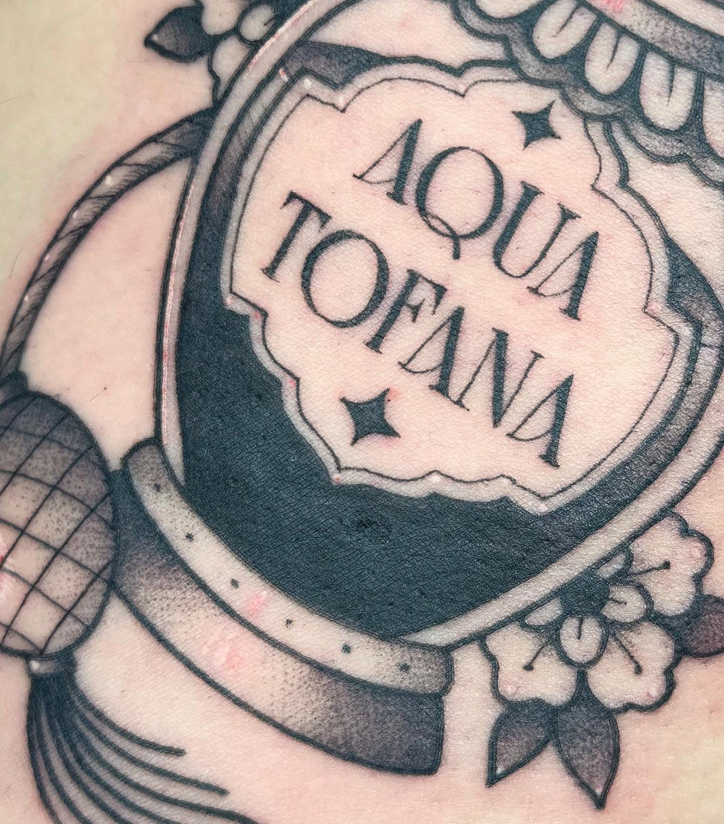 Aqua Tofana black and grey tattoo by Hali Larkin