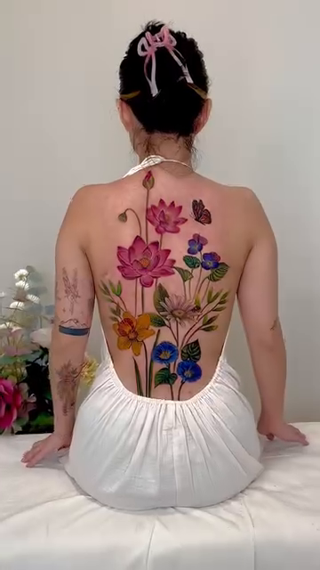 Full back floral tattoo watercolor tattoo on the back by Claire