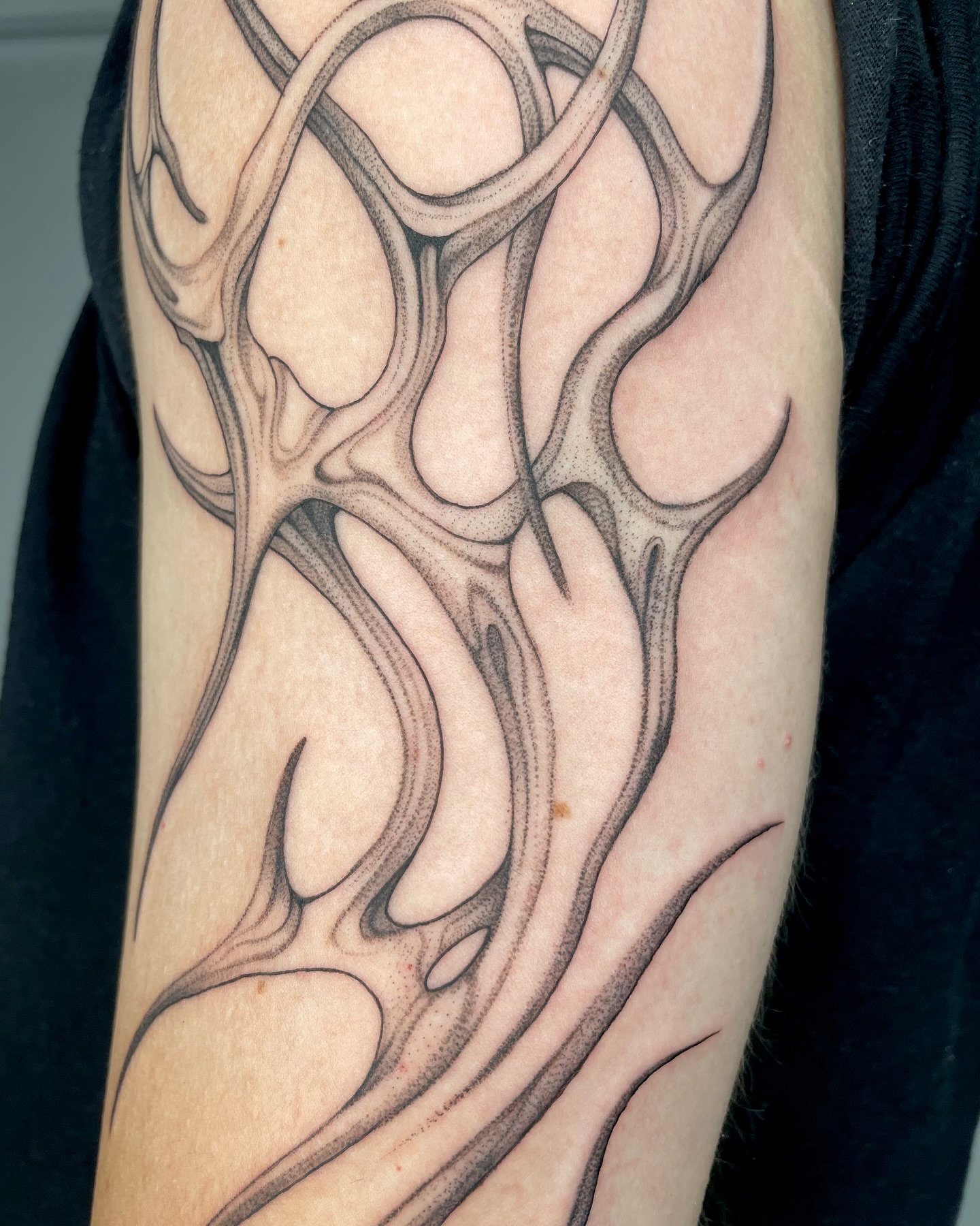 Flame design black and grey tattoo on the forearm by 𝕮𝖆𝖗𝖔𝖑𝖎𝖓𝖊 𝕽𝖆𝖊 𝕽𝖔𝖇𝖎𝖓𝖘𝖔𝖓, Los Angeles, California