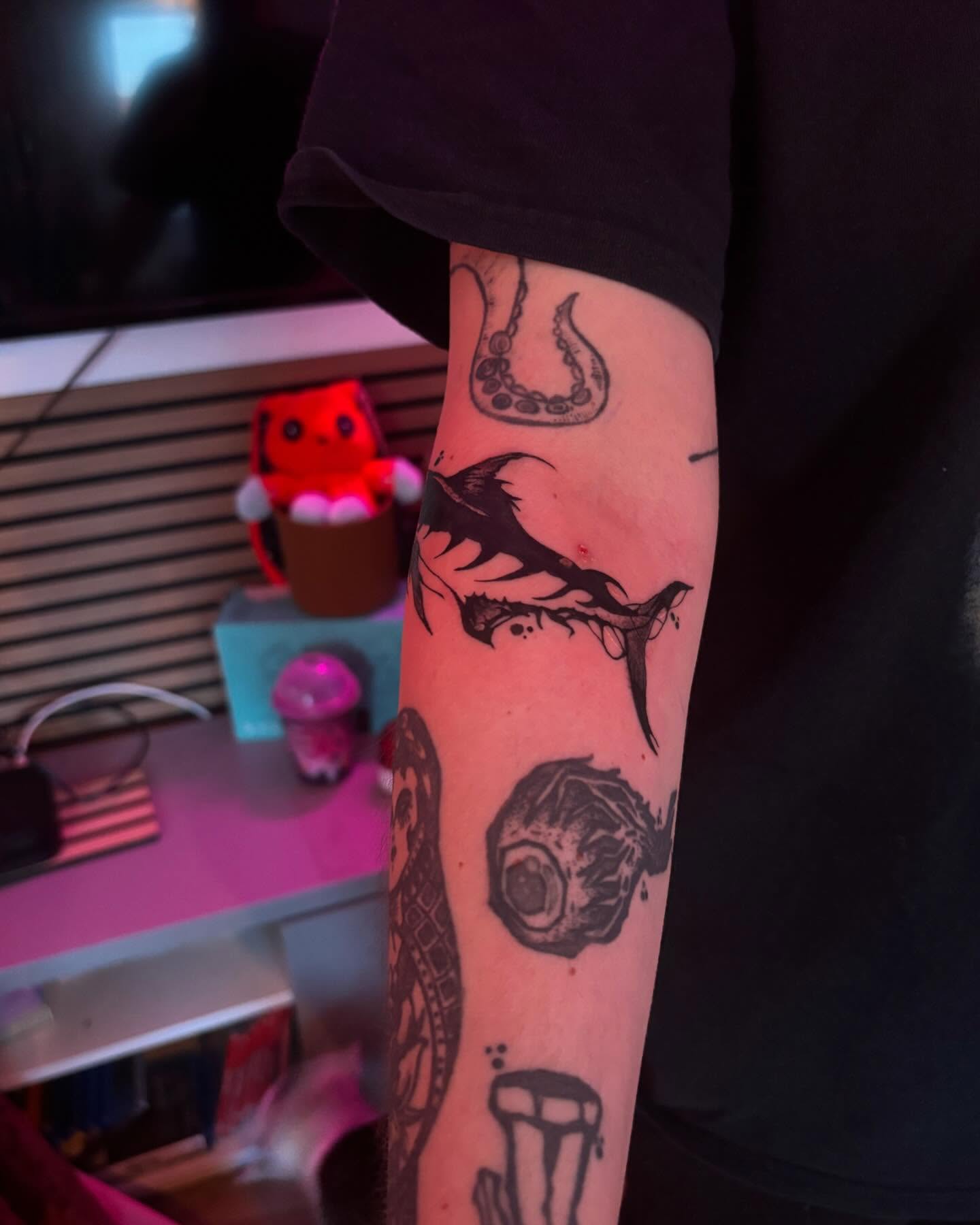 Shark and eye black and grey tattoo on the forearm by lu ๐