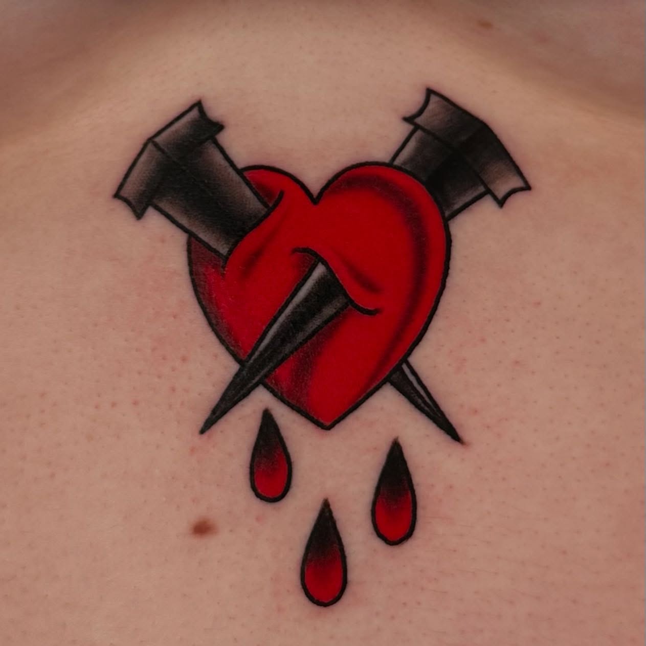 Broken heart American traditional tattoo on the chest by MR