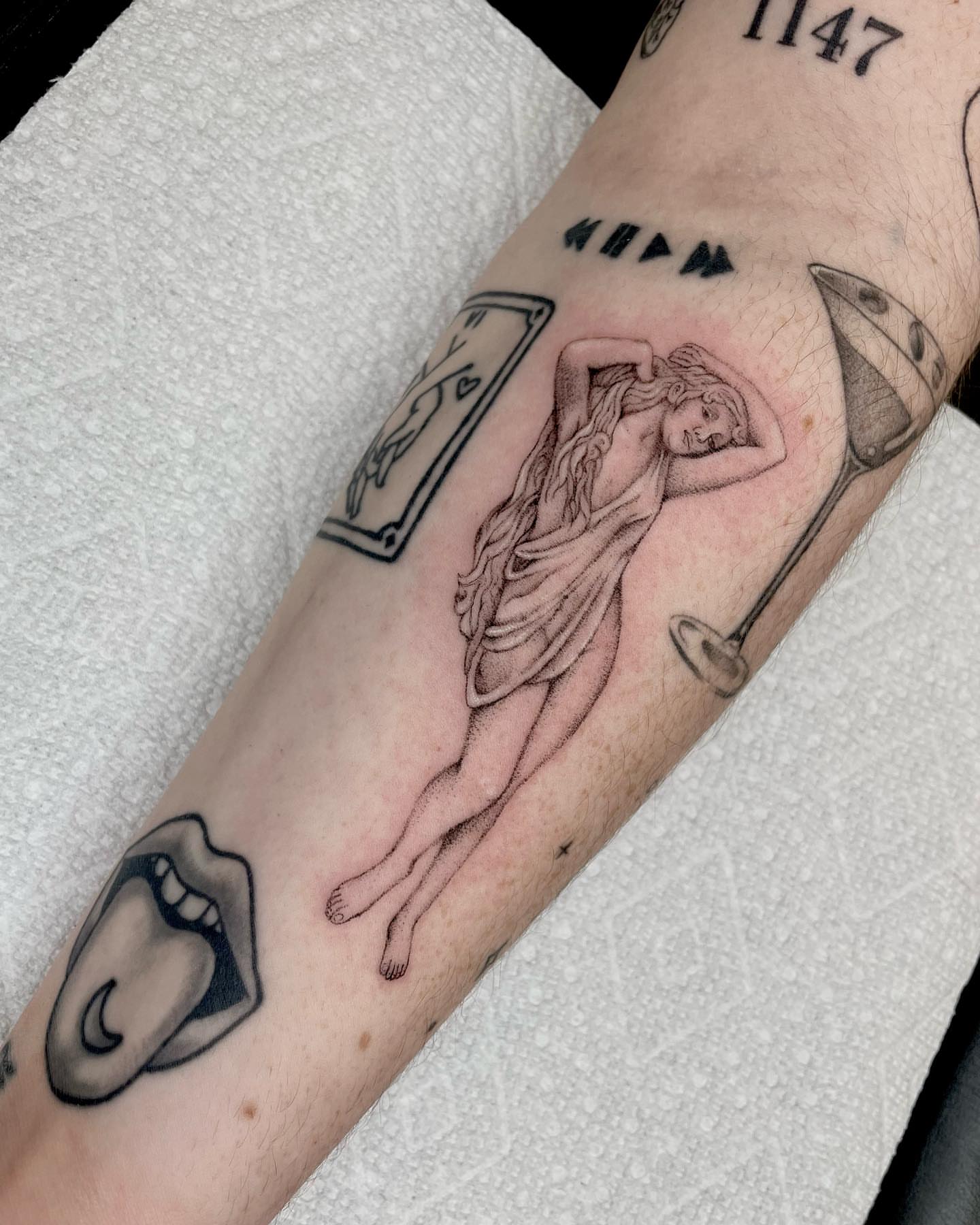 Woman black and grey tattoo on the forearm by madison, Cincinnati