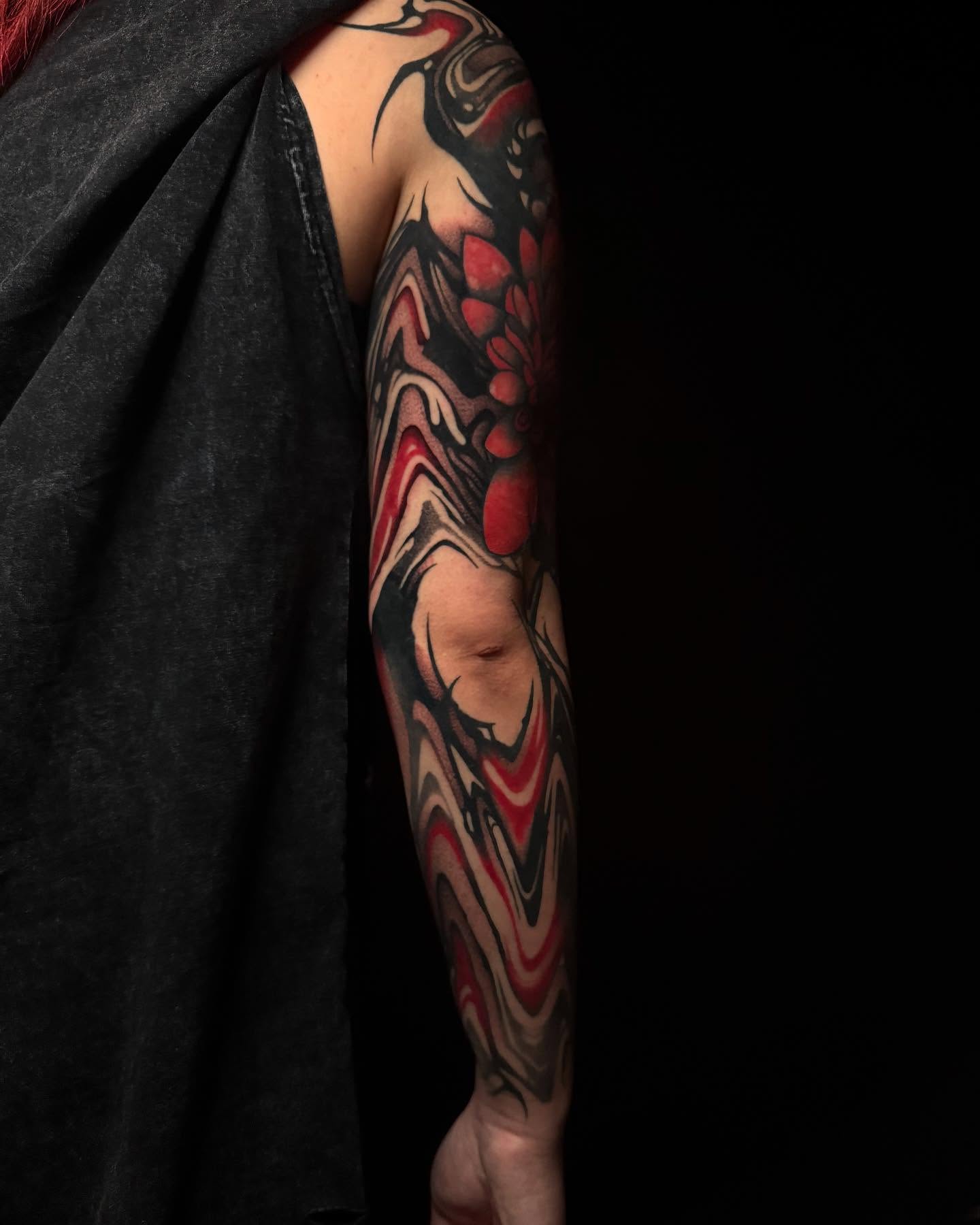 Abstract floral japanese irezumi tattoo on the forearm by Dylan Orbock, Berkeley, California