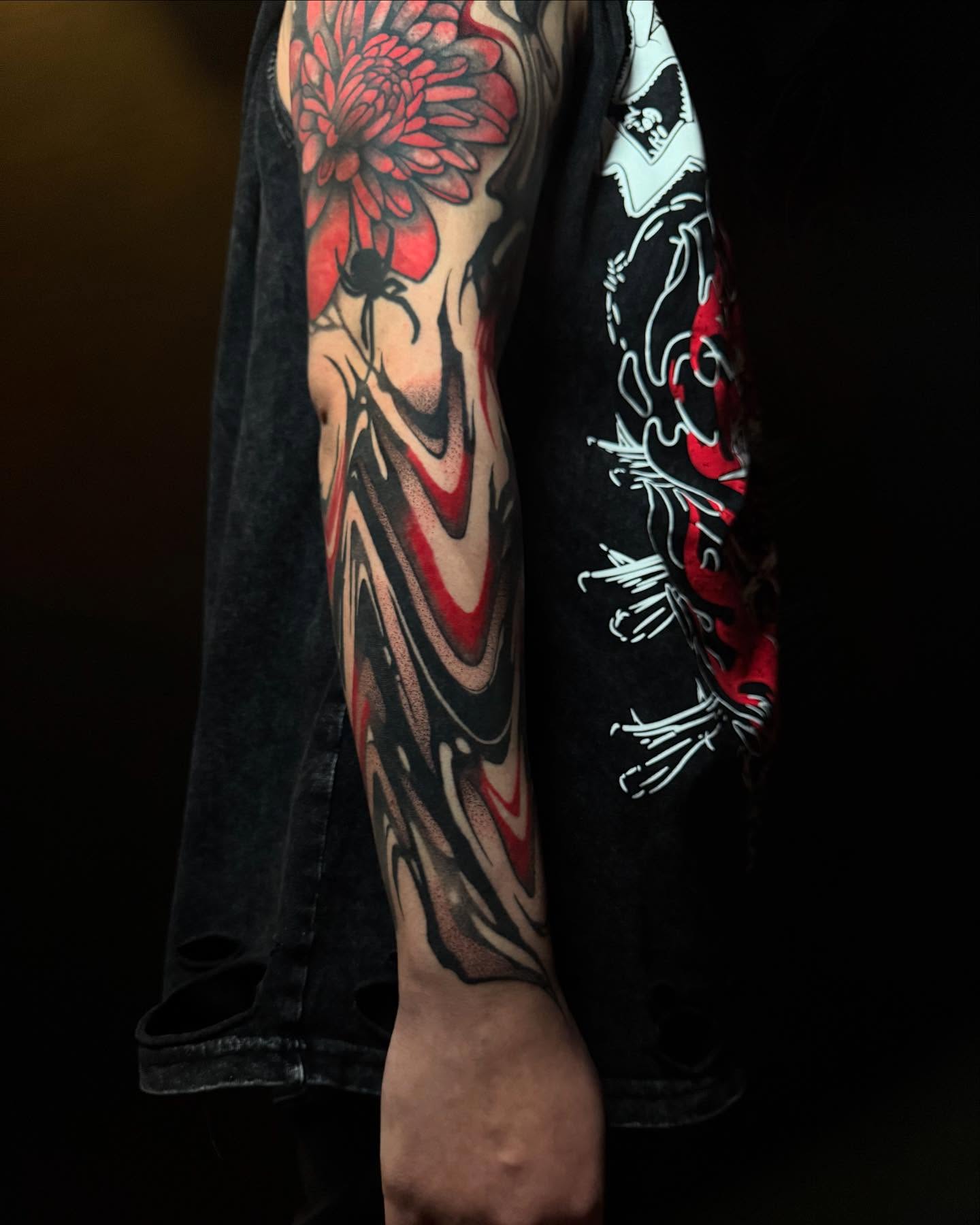 Chrysanthemum dotwork tattoo on the forearm by Dylan Orbock, Berkeley, California