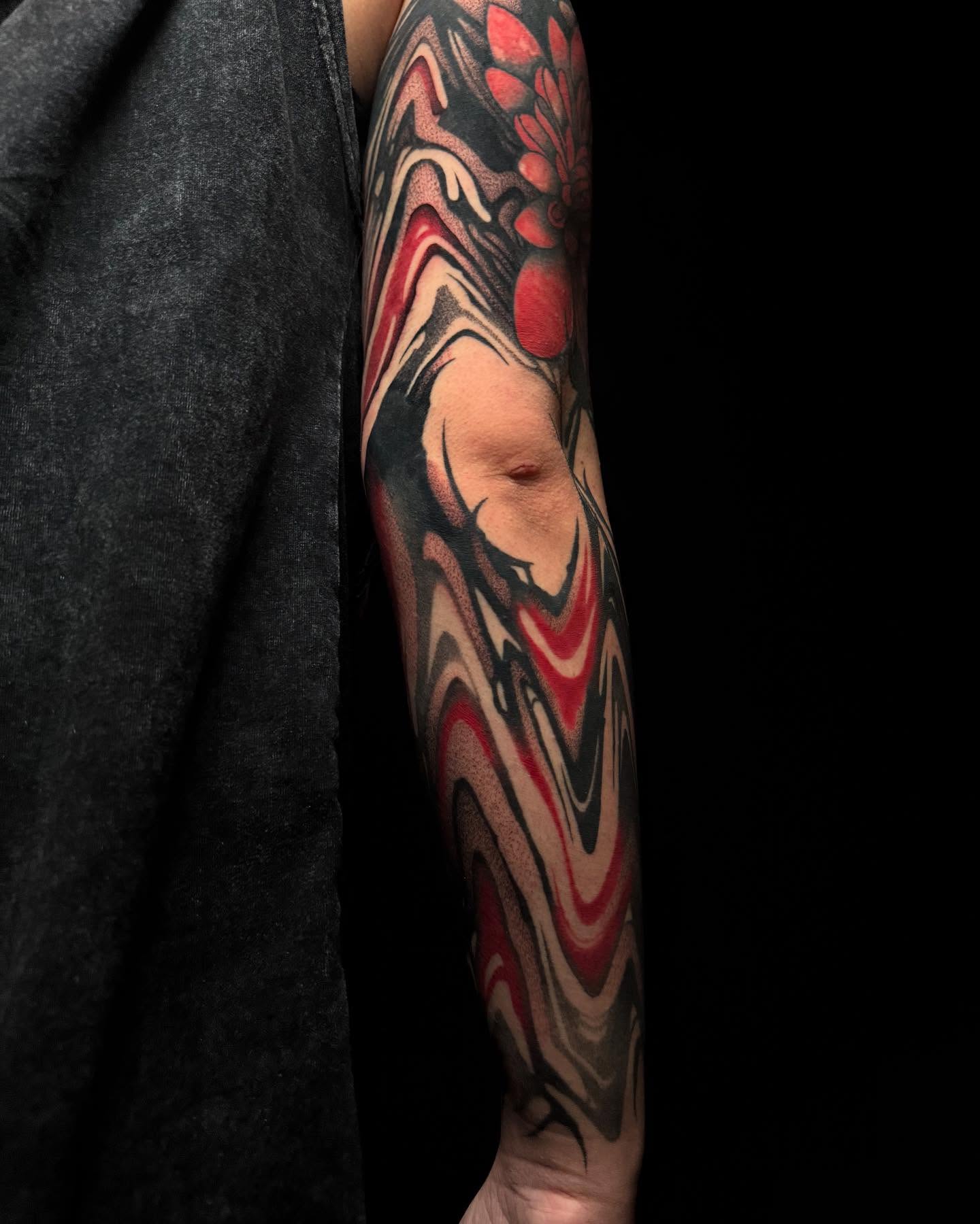 Abstract swirls dotwork tattoo on the forearm by Dylan Orbock, Berkeley, California