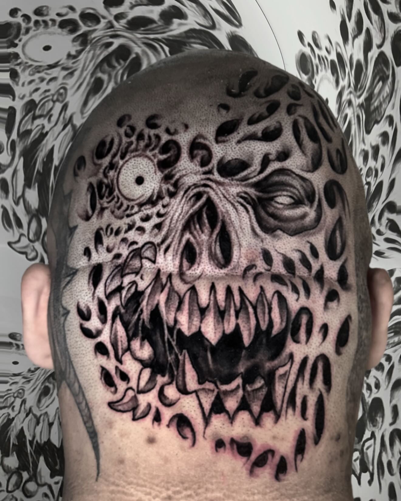 Monster face dark realism tattoo on the back by ⠀Joey Rosado