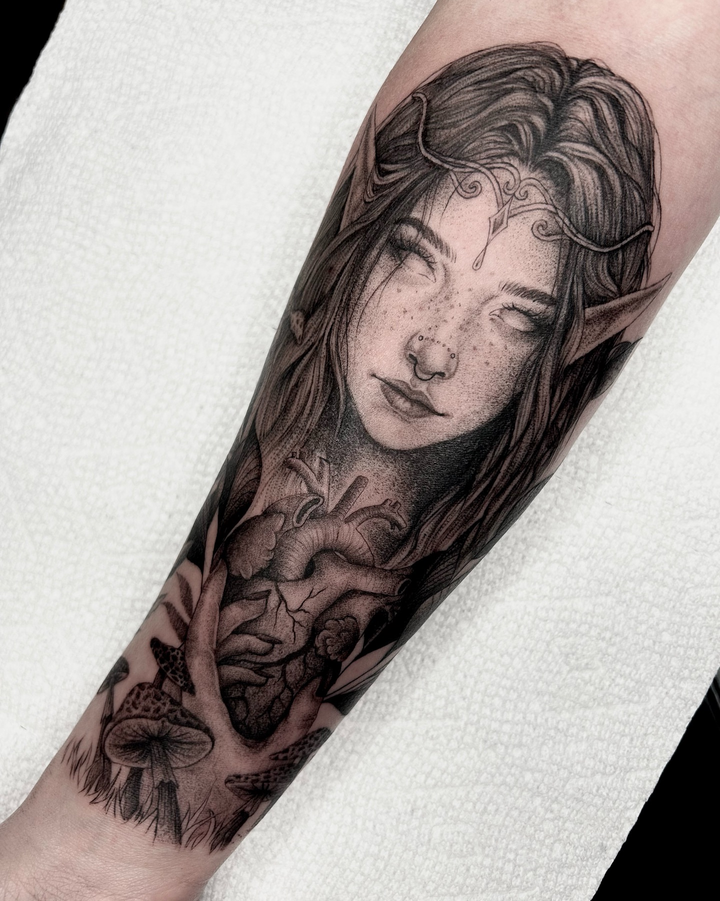 Elf woman with heart realism tattoo on the forearm by 𝕤𝕒𝕧𝕒𝕟𝕟𝕒