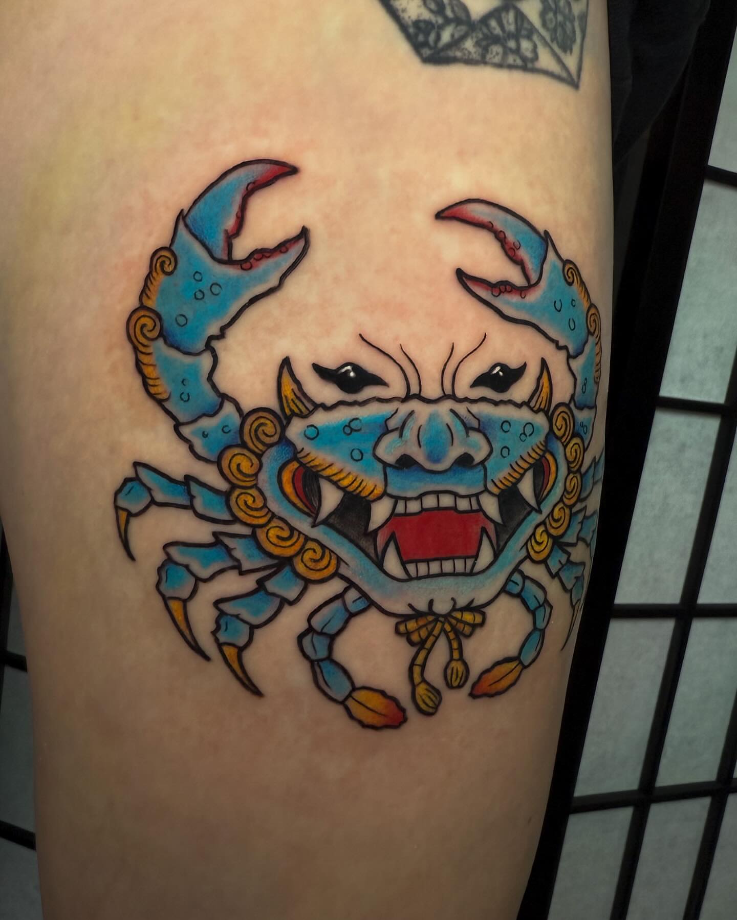 Crab American traditional tattoo on the thigh by Demi DiMartino