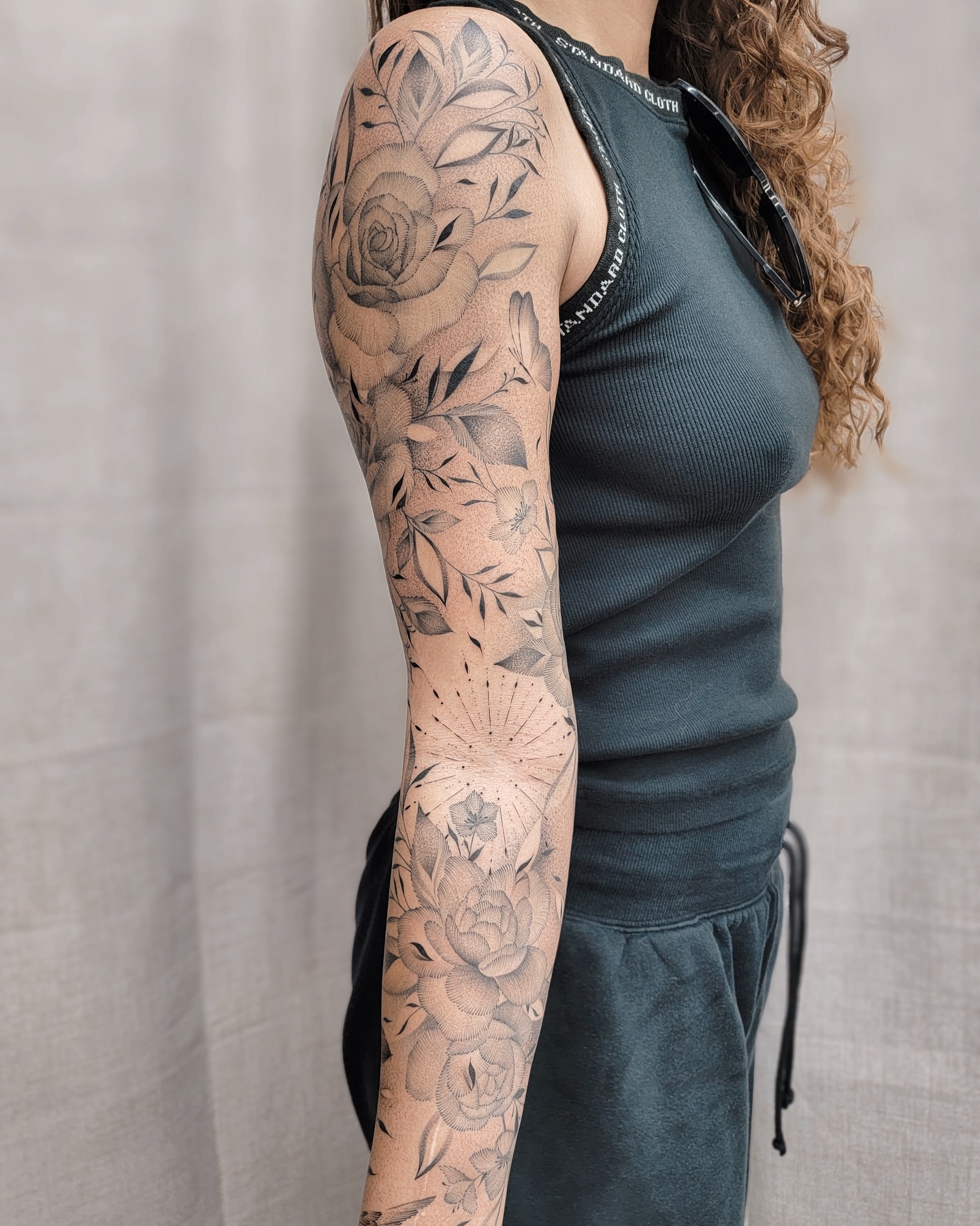 Floral bouquet dotwork tattoo on the upper arm by Houston Tattoo Artist