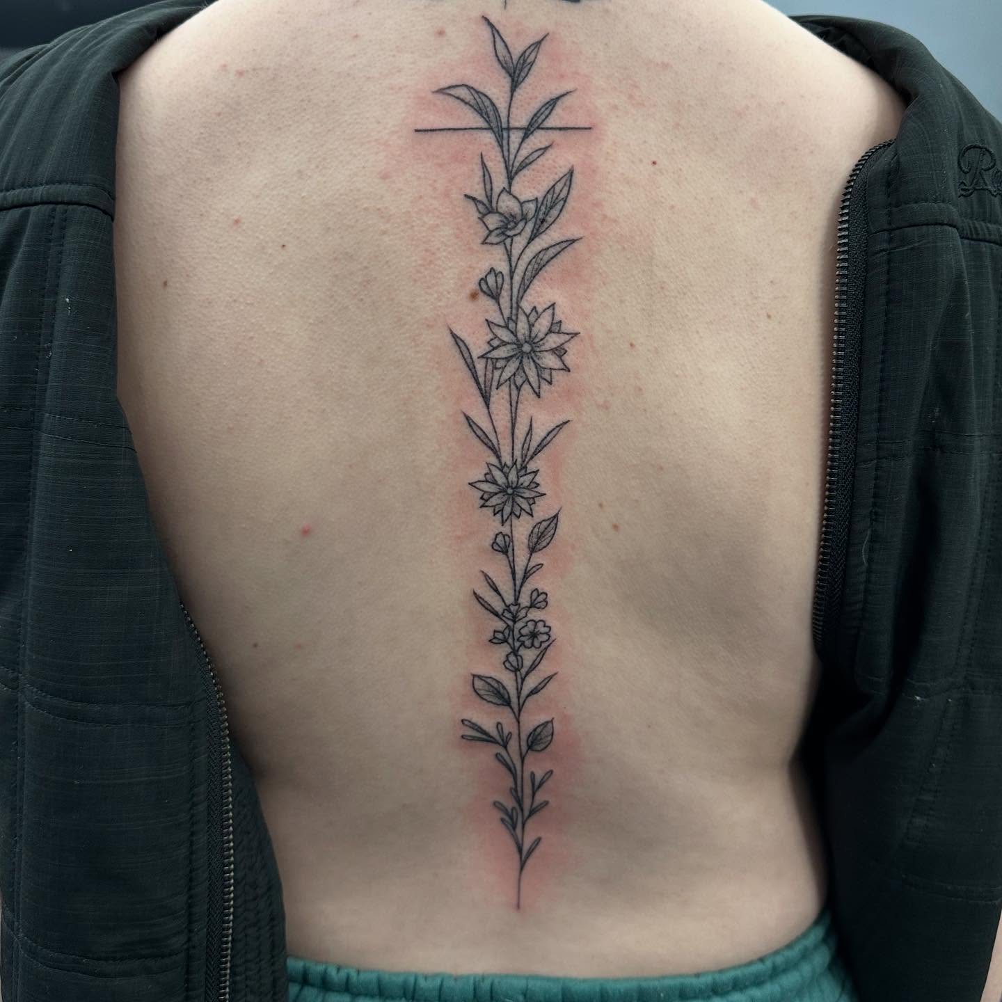 Floral vine black and grey tattoo on the back by Travis Dale Tattoo Artist, Austin, Texas