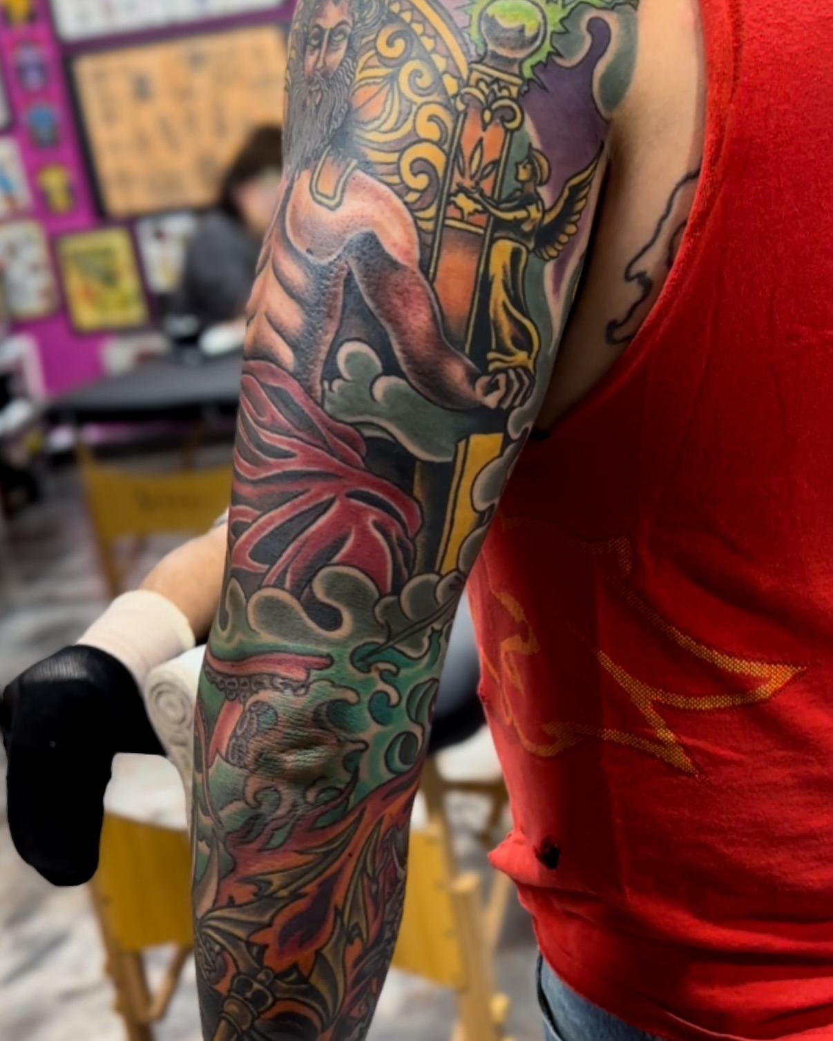 God-like figure with staff American traditional tattoo on the forearm by Marcos Rivera, Laredo, Texas