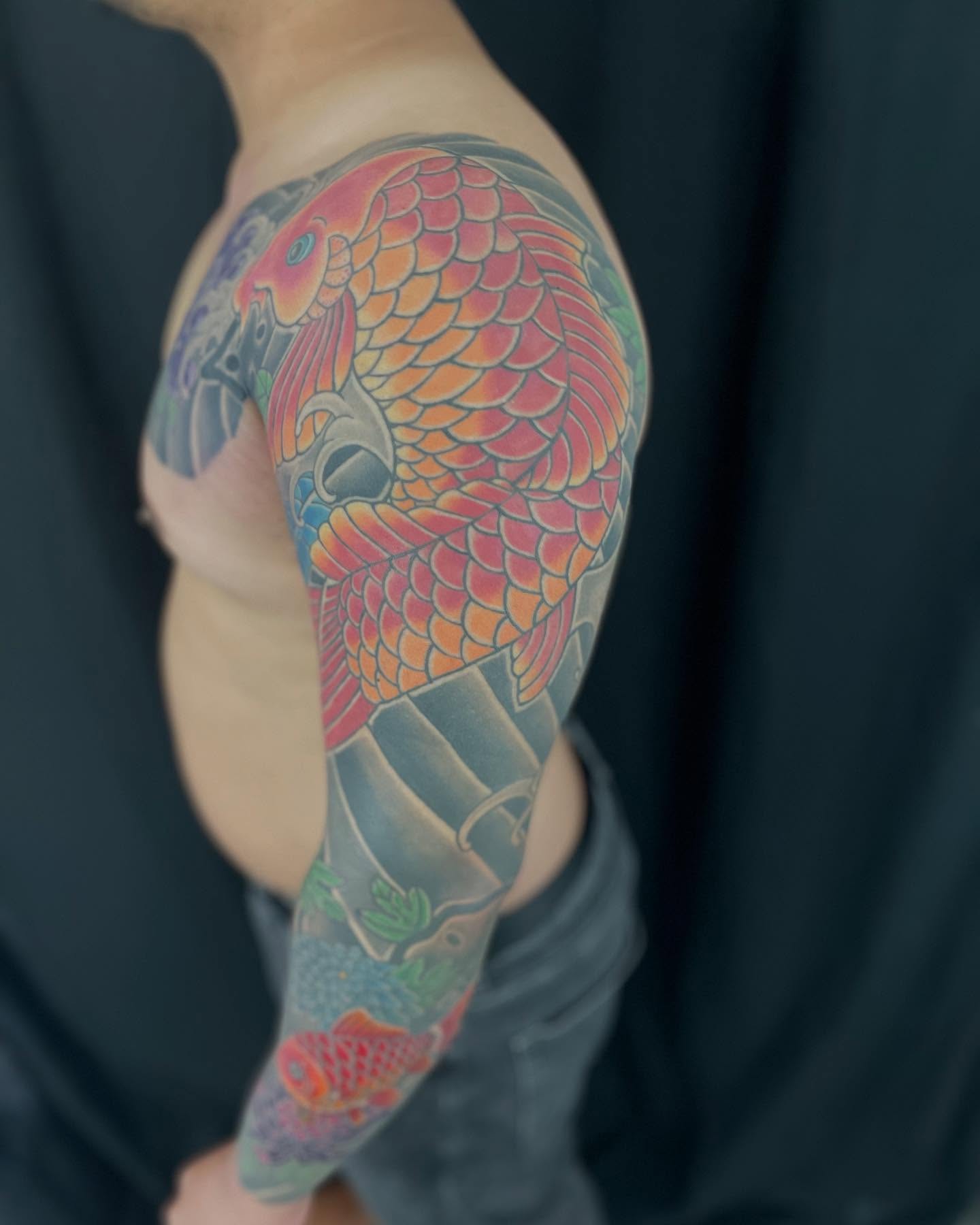 Koi fish japanese irezumi tattoo on the upper arm by Ei Horimiya Omiya