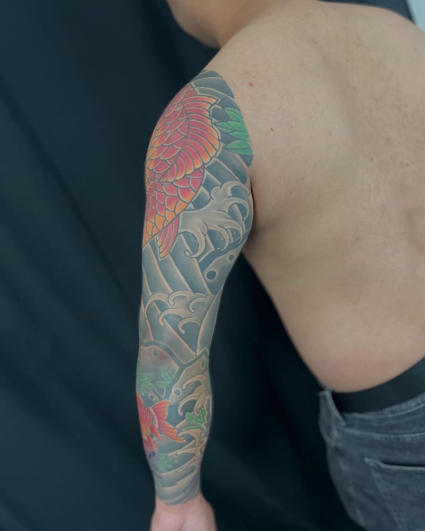 Koi fish japanese irezumi tattoo on the upper arm by Ei Horimiya Omiya