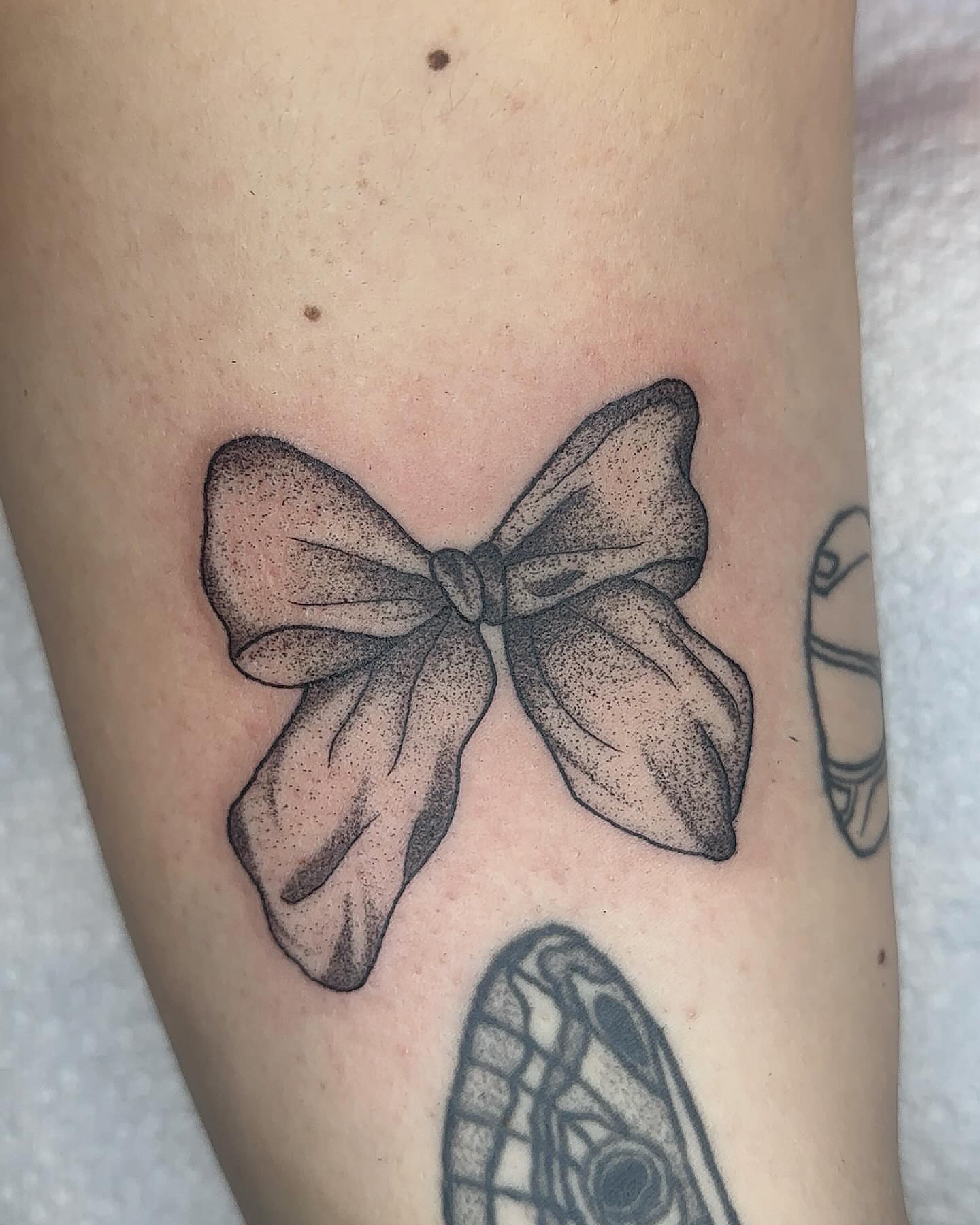 Bow dotwork tattoo on the forearm by savannah ★ ( previously feralratbabe )
