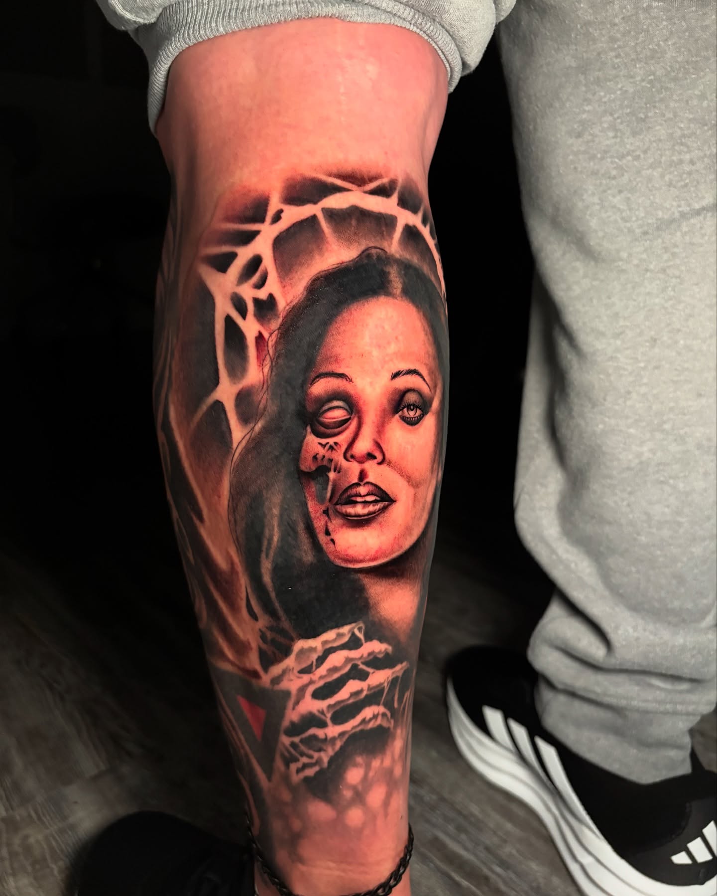 Woman's face realism tattoo on the forearm by Eric Garcia