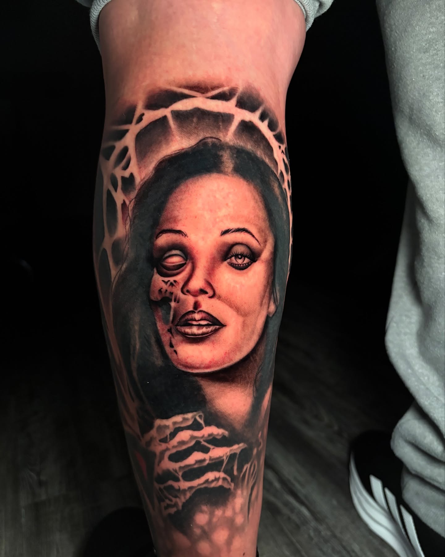 Woman's face realism tattoo on the forearm by Eric Garcia
