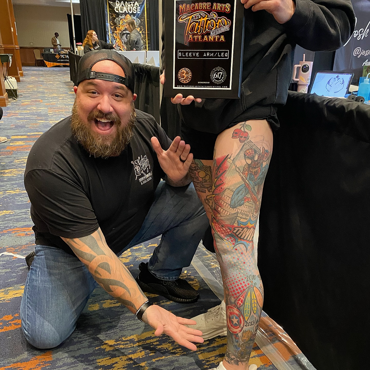 Superhero-themed sleeve American traditional tattoo on the upper arm by Josh St.germain