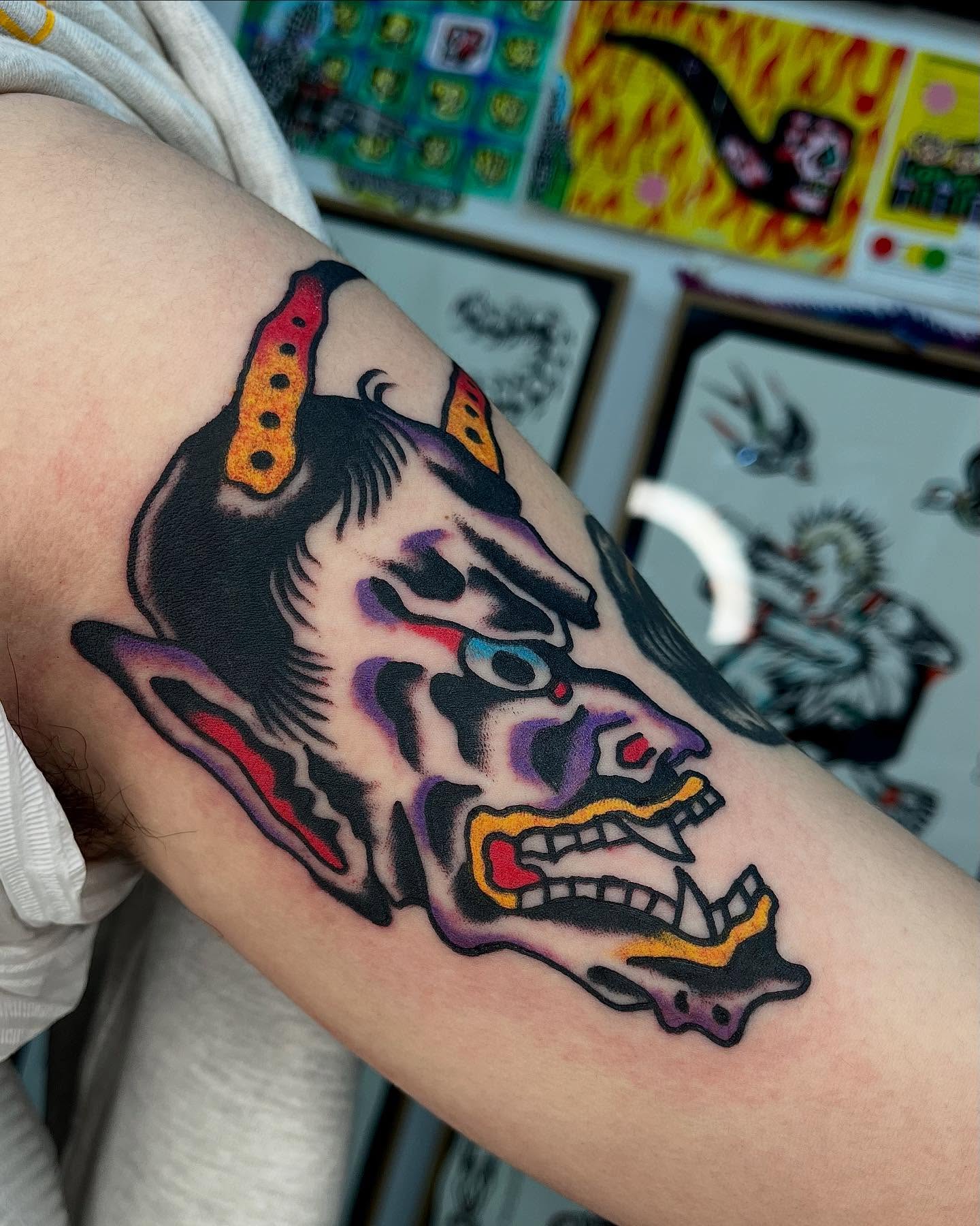 Demon head American traditional tattoo on the forearm by Jimmy Ho
