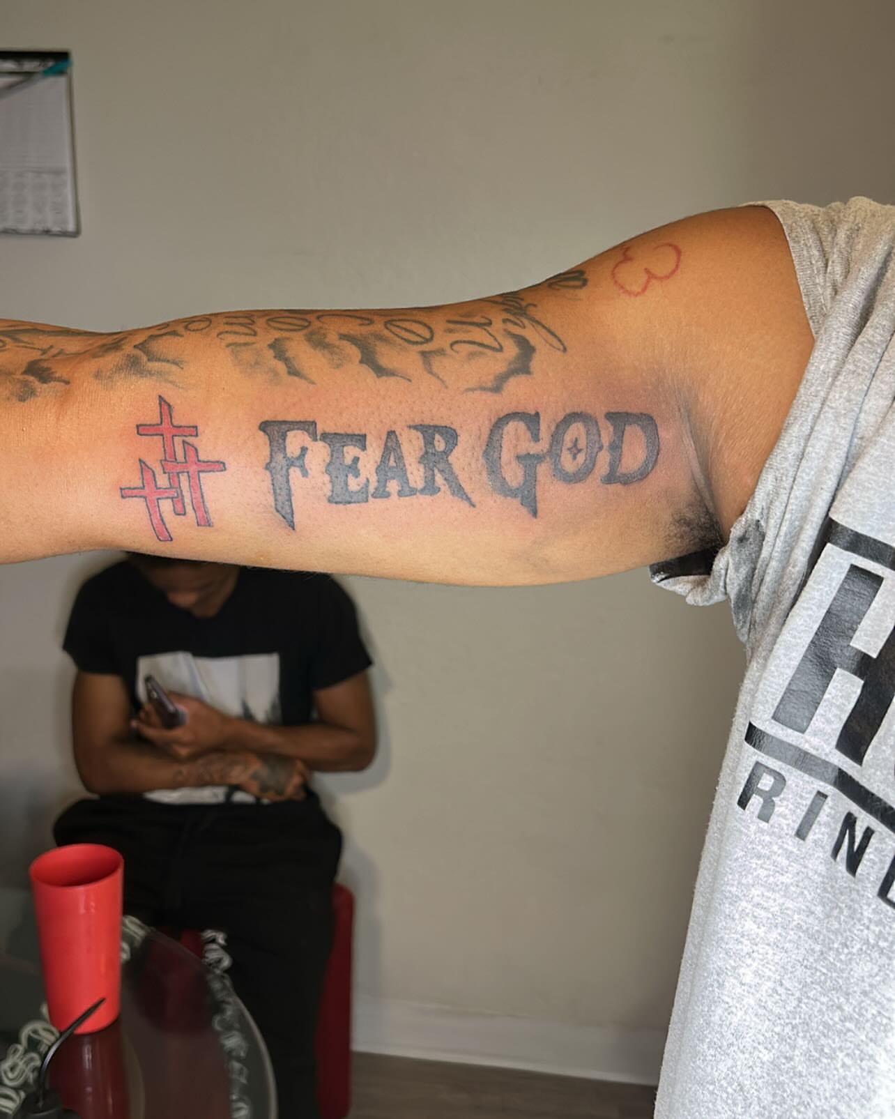 Fear god lettering script tattoo on the forearm by 702tattoo💉🩸