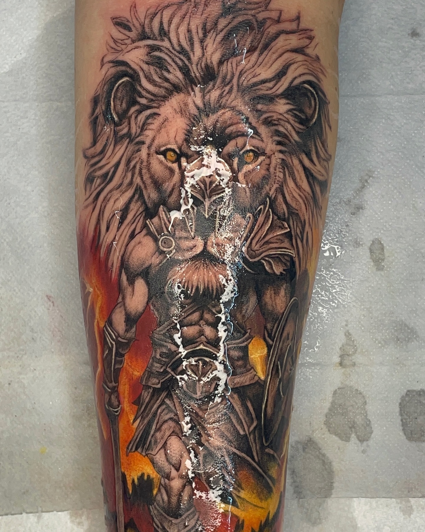 Lion warrior realism tattoo on the forearm by Noriega Josué