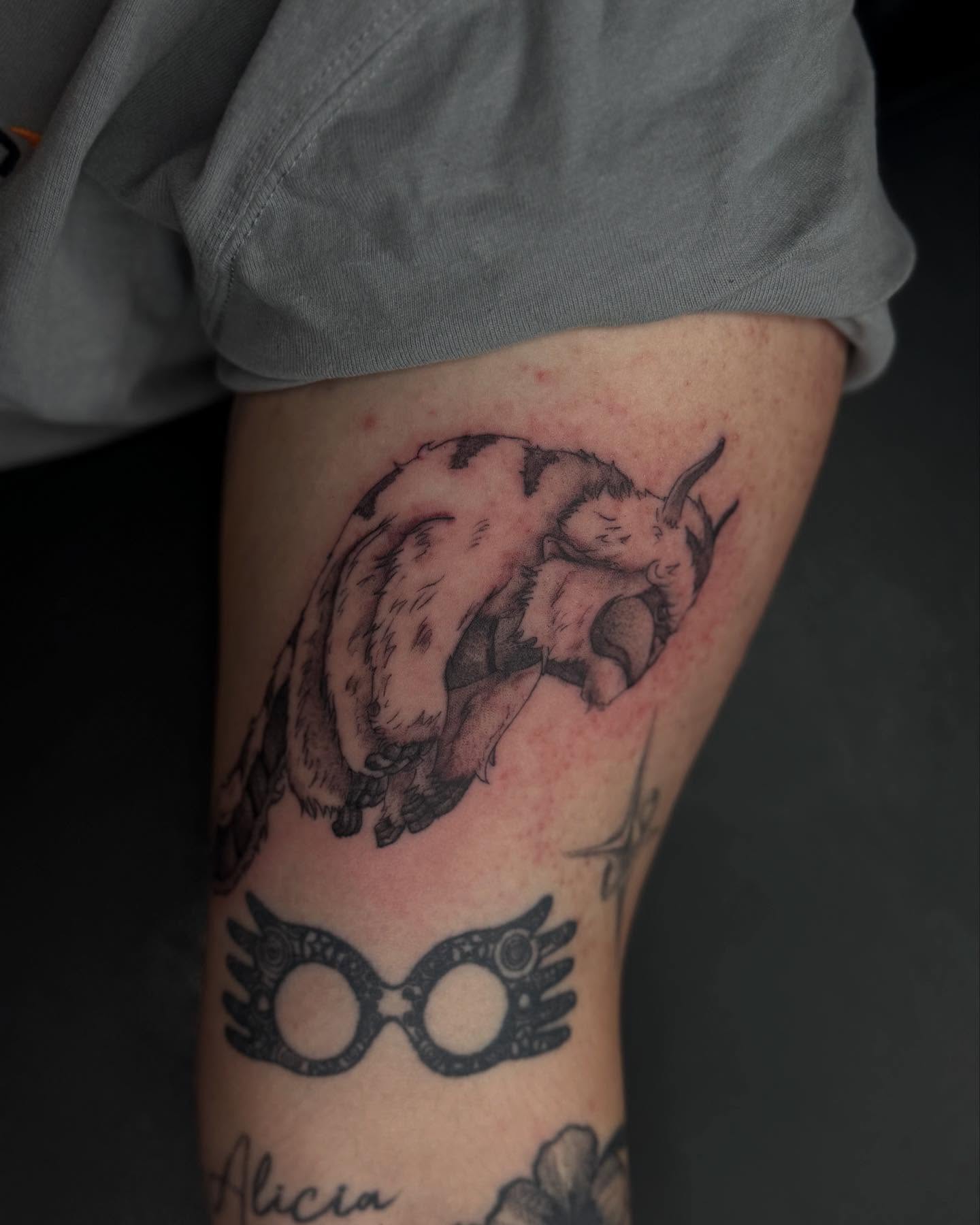 Goat and mask realism tattoo on the thigh by Alexa Camacho