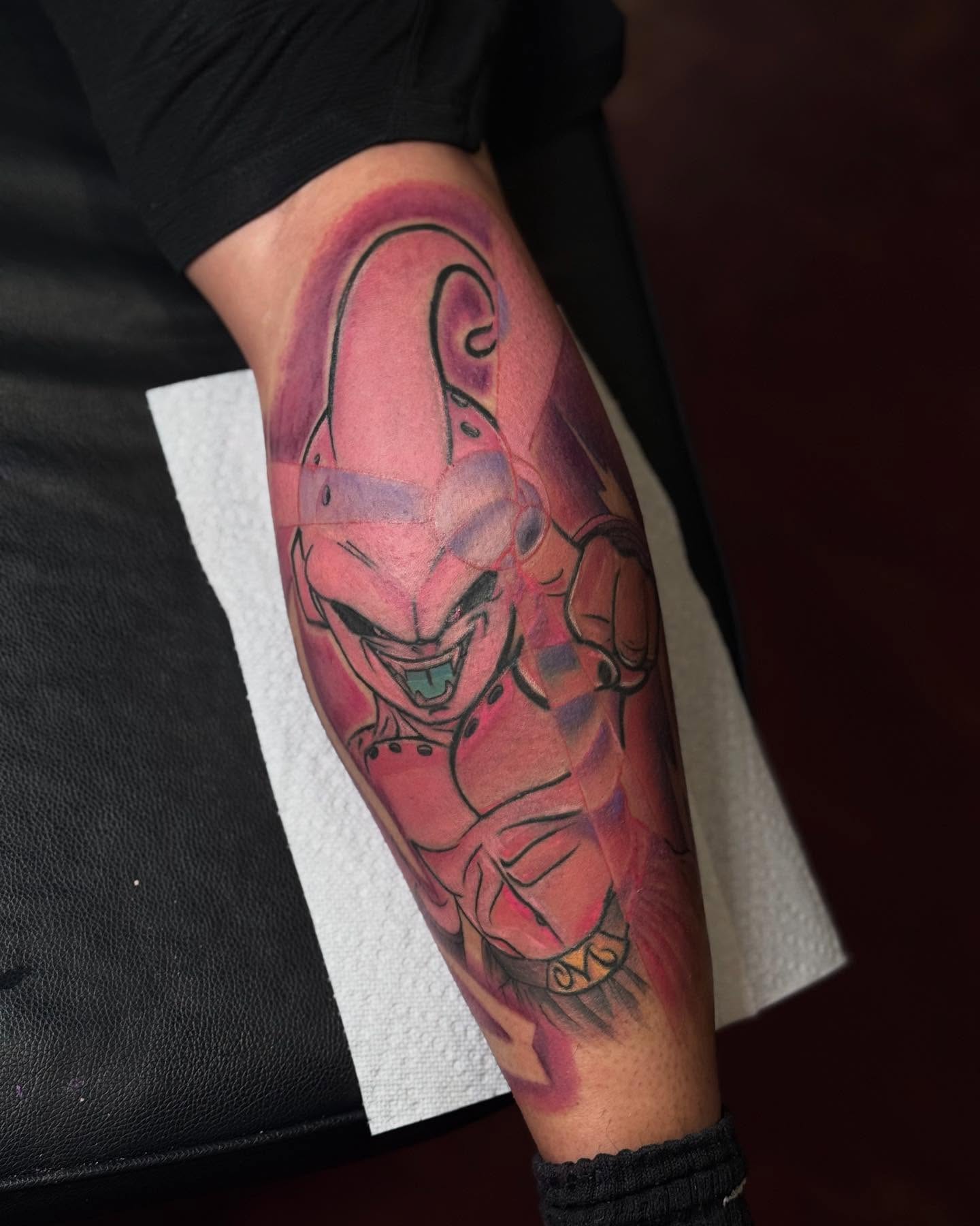 Pink alien anime tattoo on the forearm by Stephanie Cruz, Kansas City, Missouri
