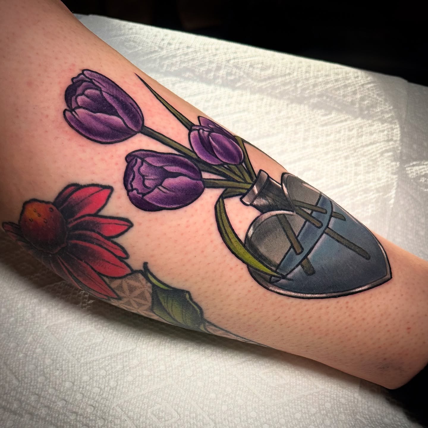Tulips and shoe realism tattoo on the forearm by ✨Sarah Knapp✨, Eugene, Oregon