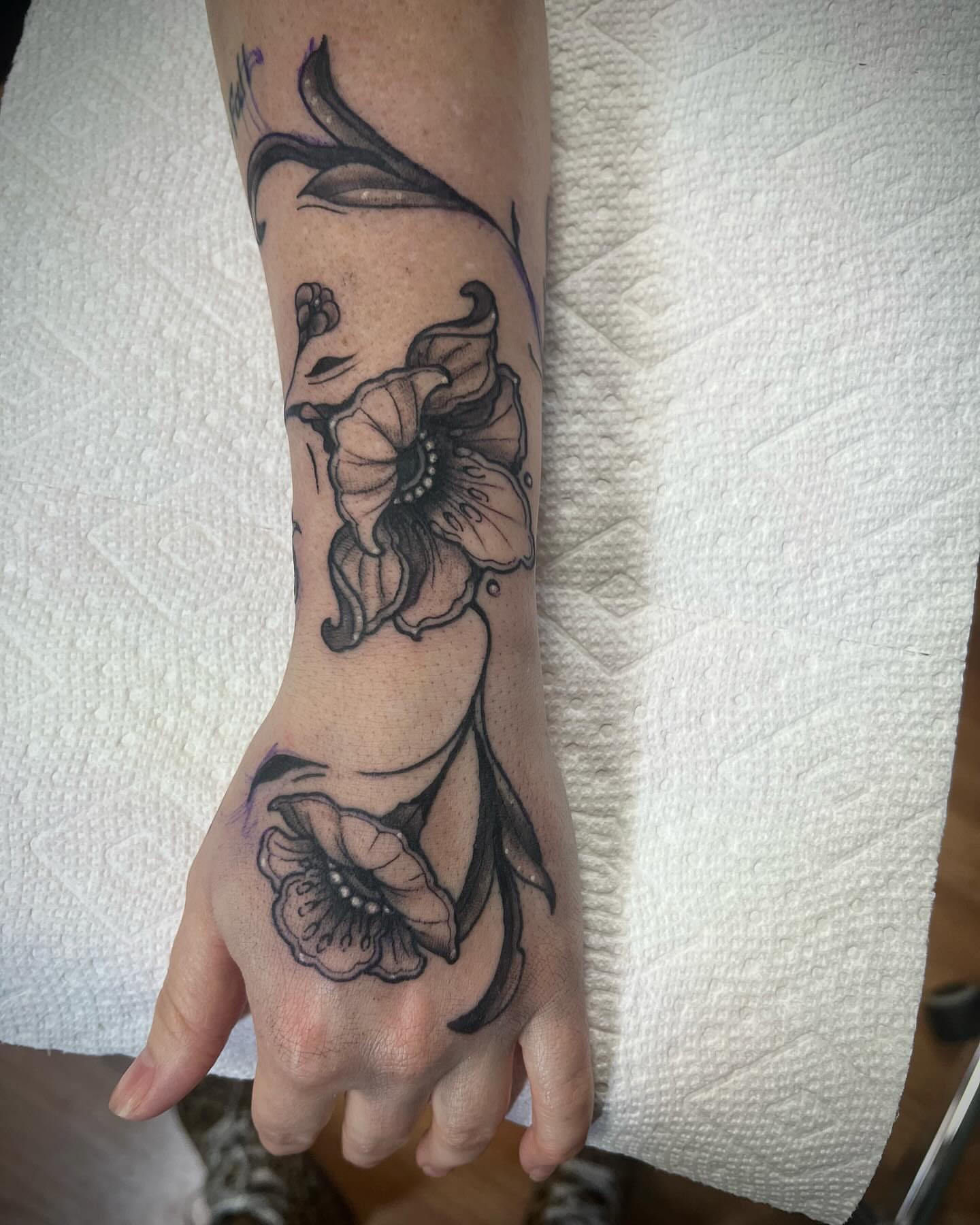 Flower black and grey tattoo on the hand by Katie Sayre
