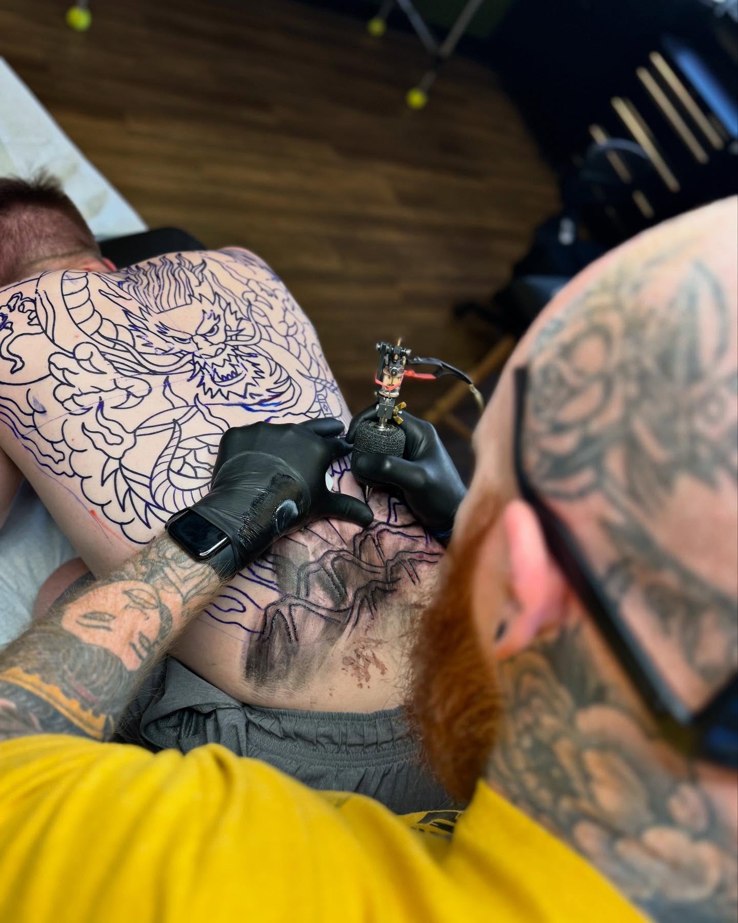 Dragon American traditional tattoo on the chest by Noah Diffenderfer, Phoenix, Arizona