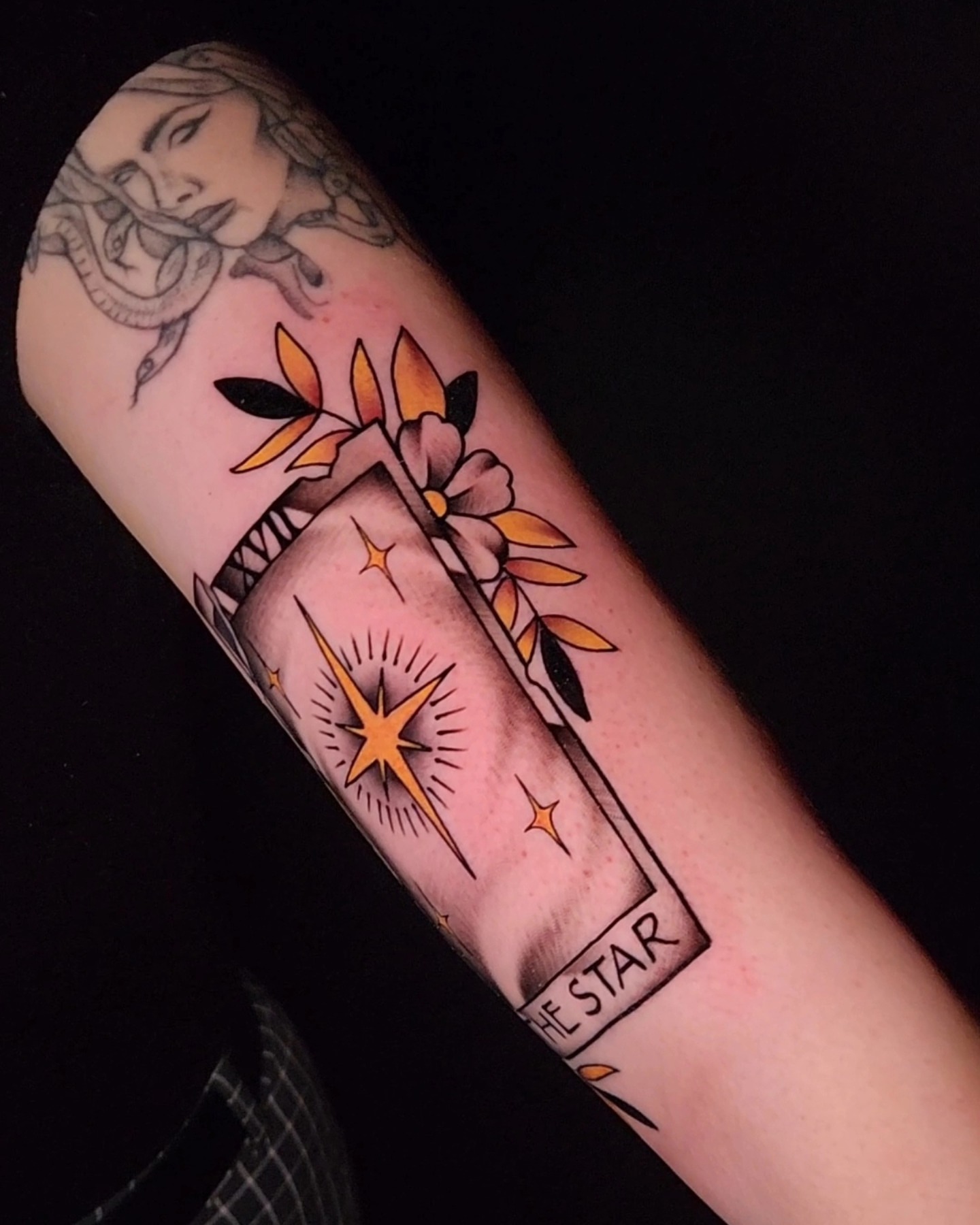 Flower and star American traditional tattoo on the forearm by ⚔️ Shane ⚔️