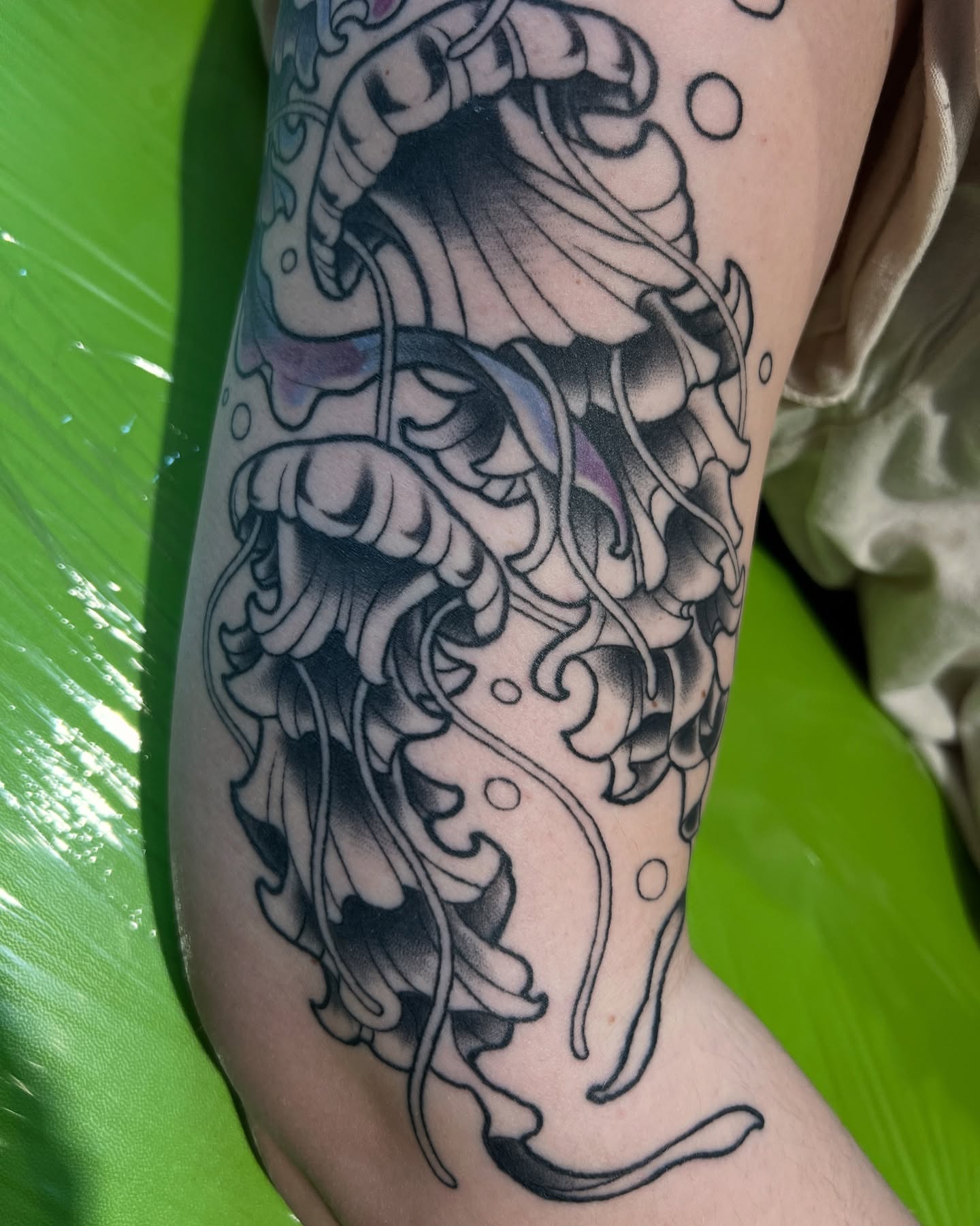 Jellyfish black and grey tattoo on the forearm by Belle Halverson