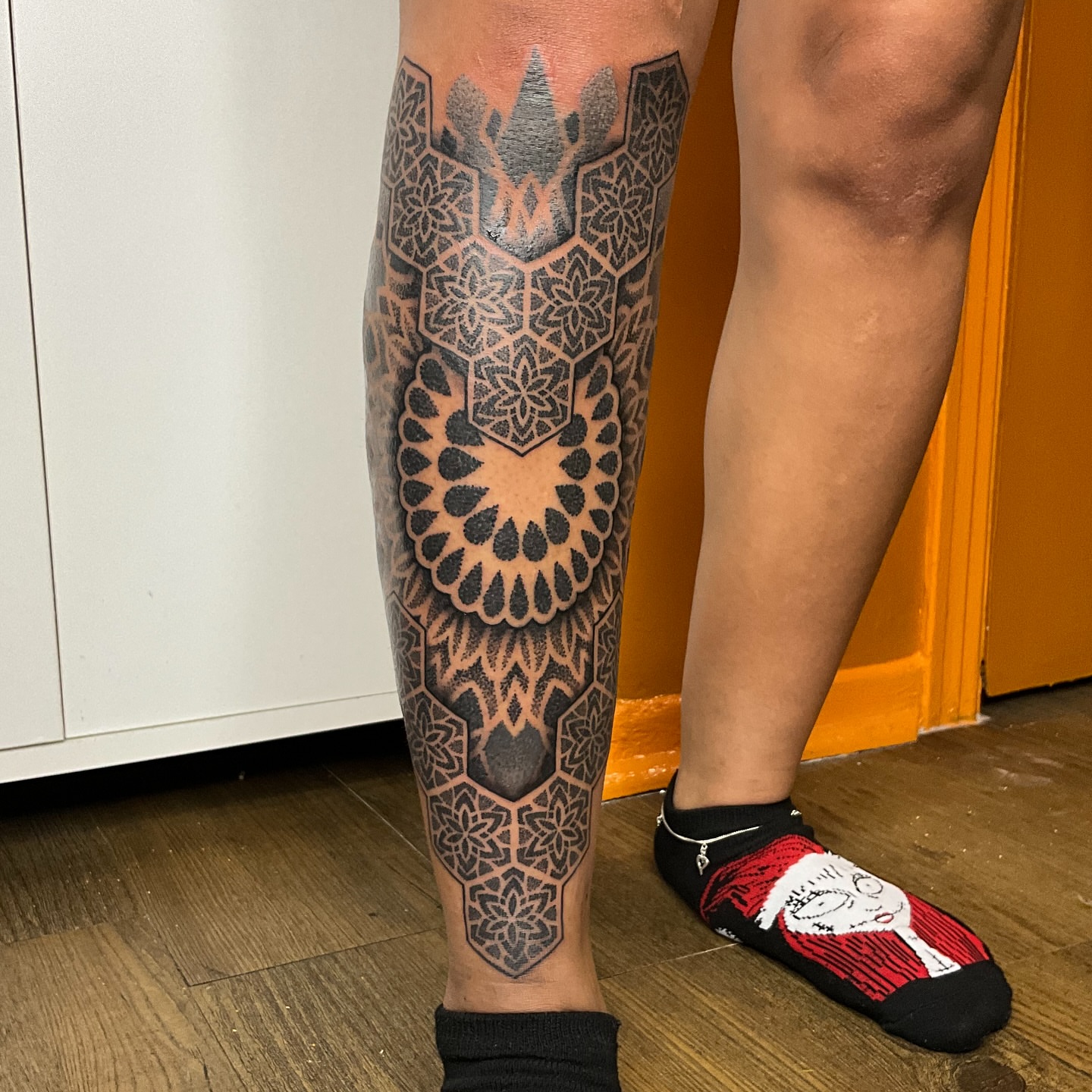 Geometric mandala geometric tattoo on the calf by Bombay Pain Co.