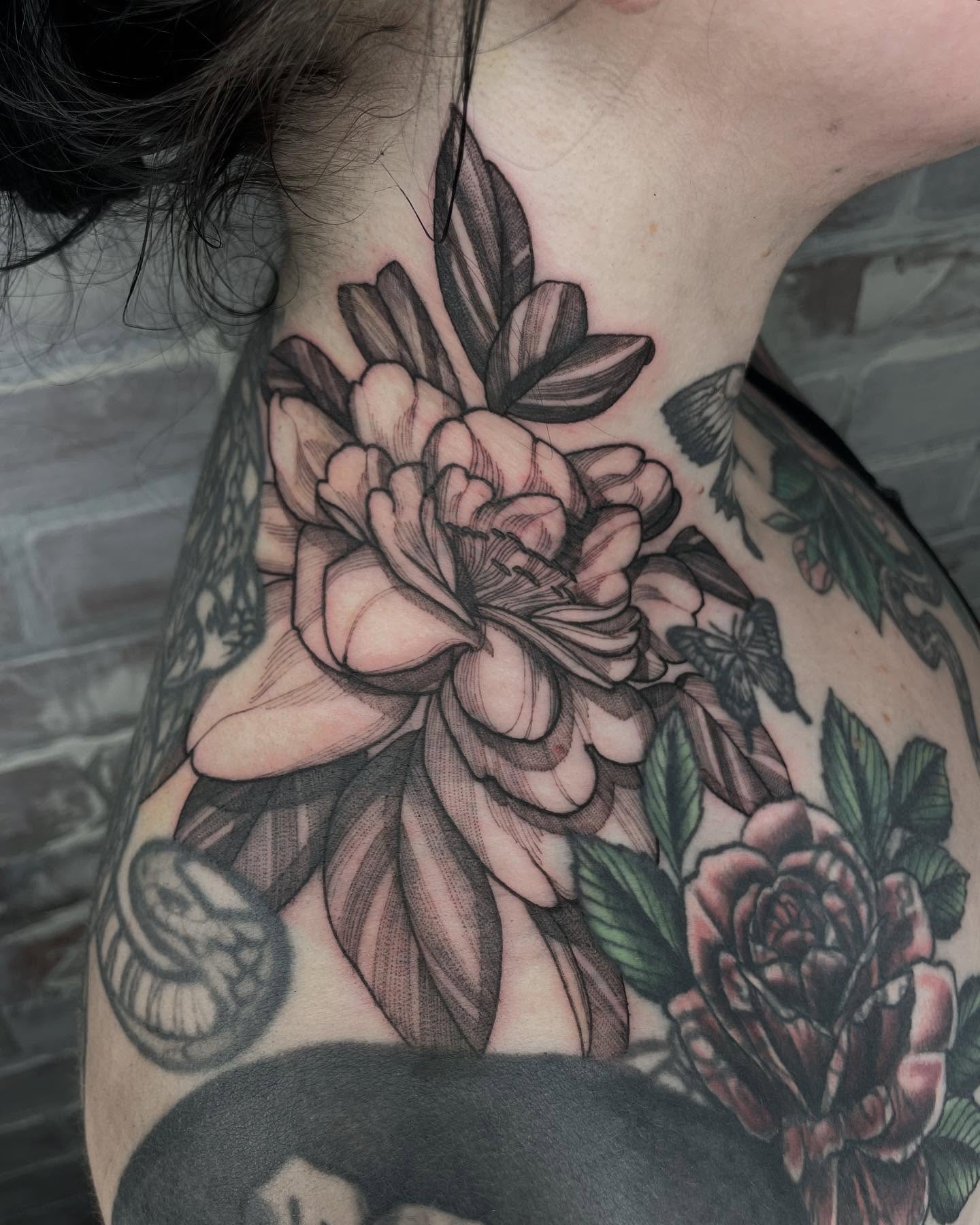 Peony black and grey tattoo on the shoulder by Carol Jacky