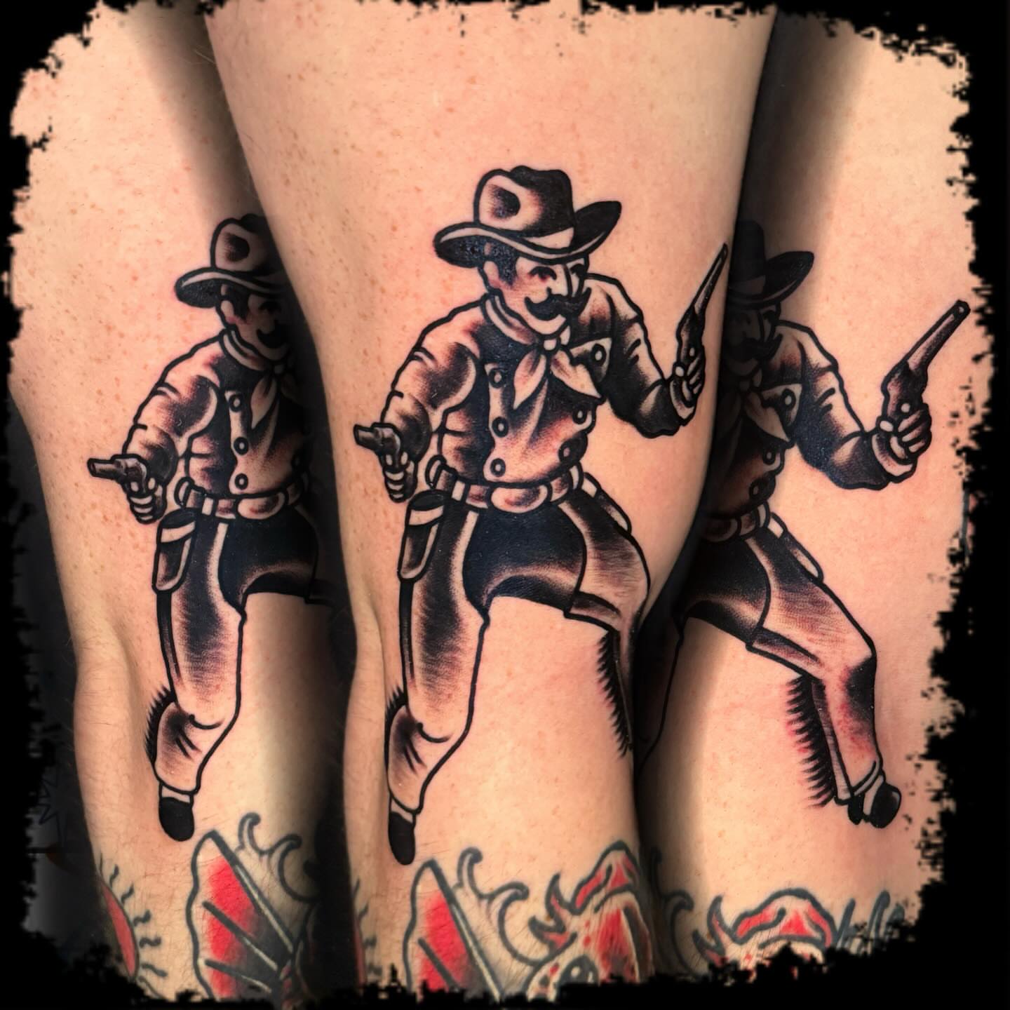 Cowboys American traditional tattoo on the thigh by Antonio DeCaro