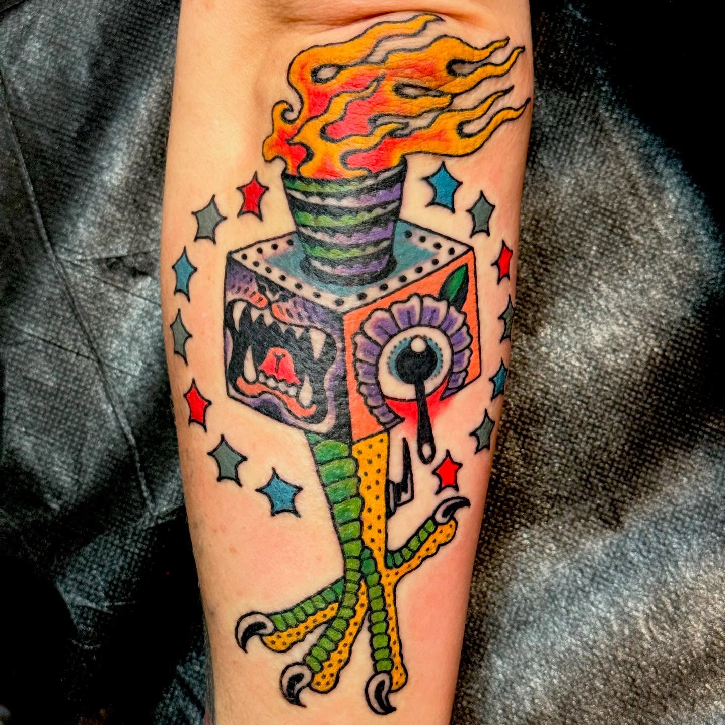 Torch and monster American traditional tattoo on the forearm by Nick Rodin