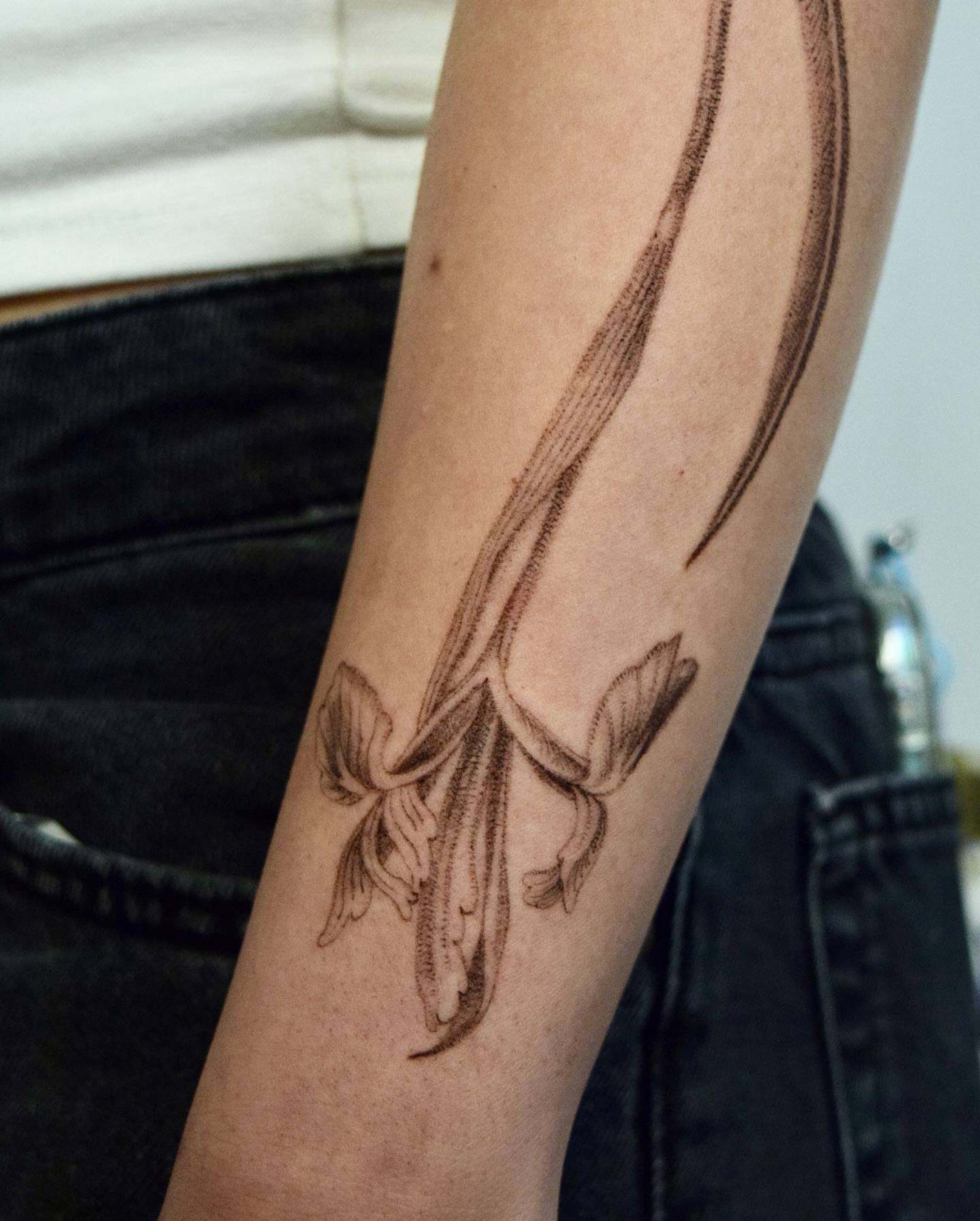 Flower black and grey tattoo on the forearm by Stella Oh