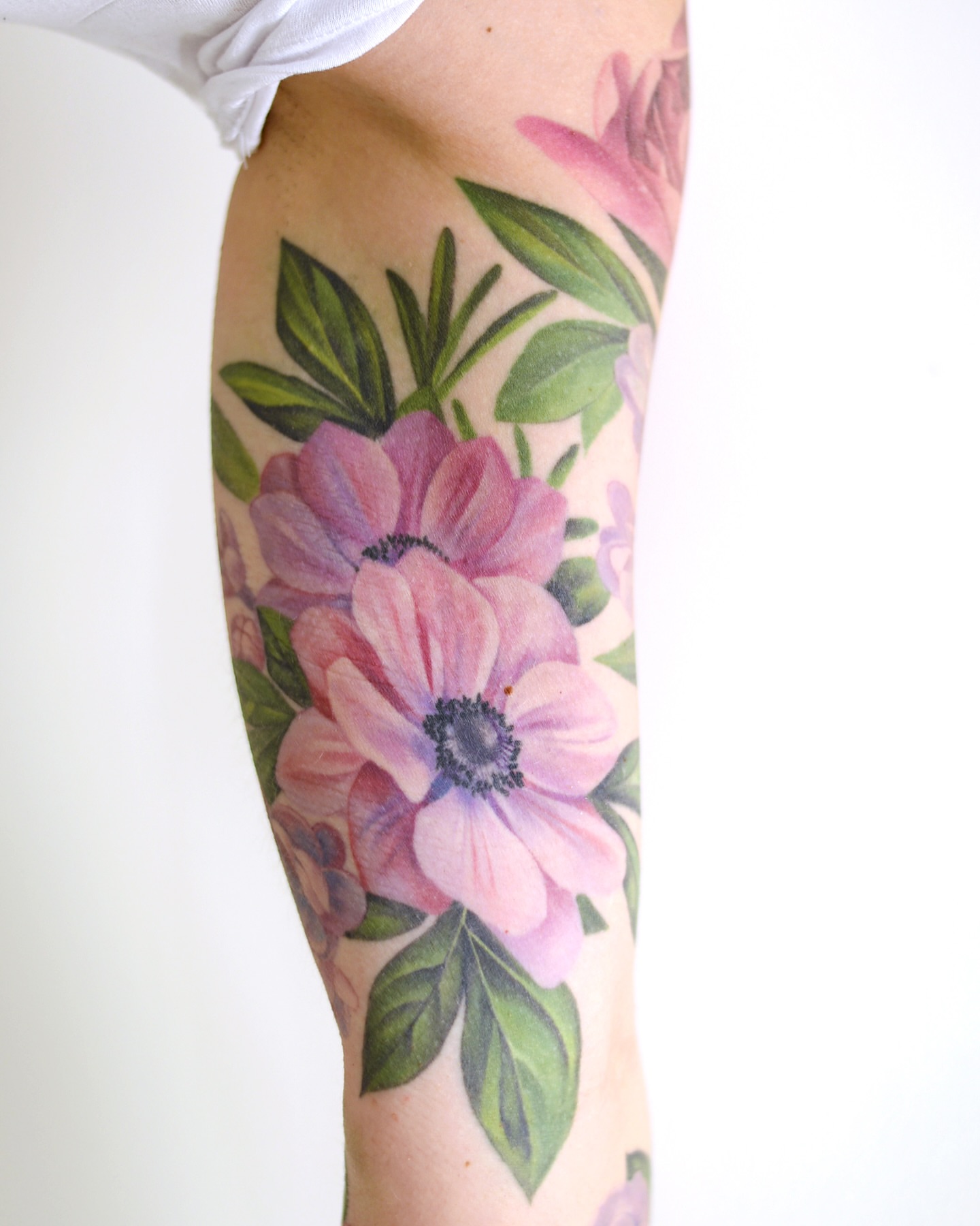 Flowers realism tattoo on the forearm by Joice Wang