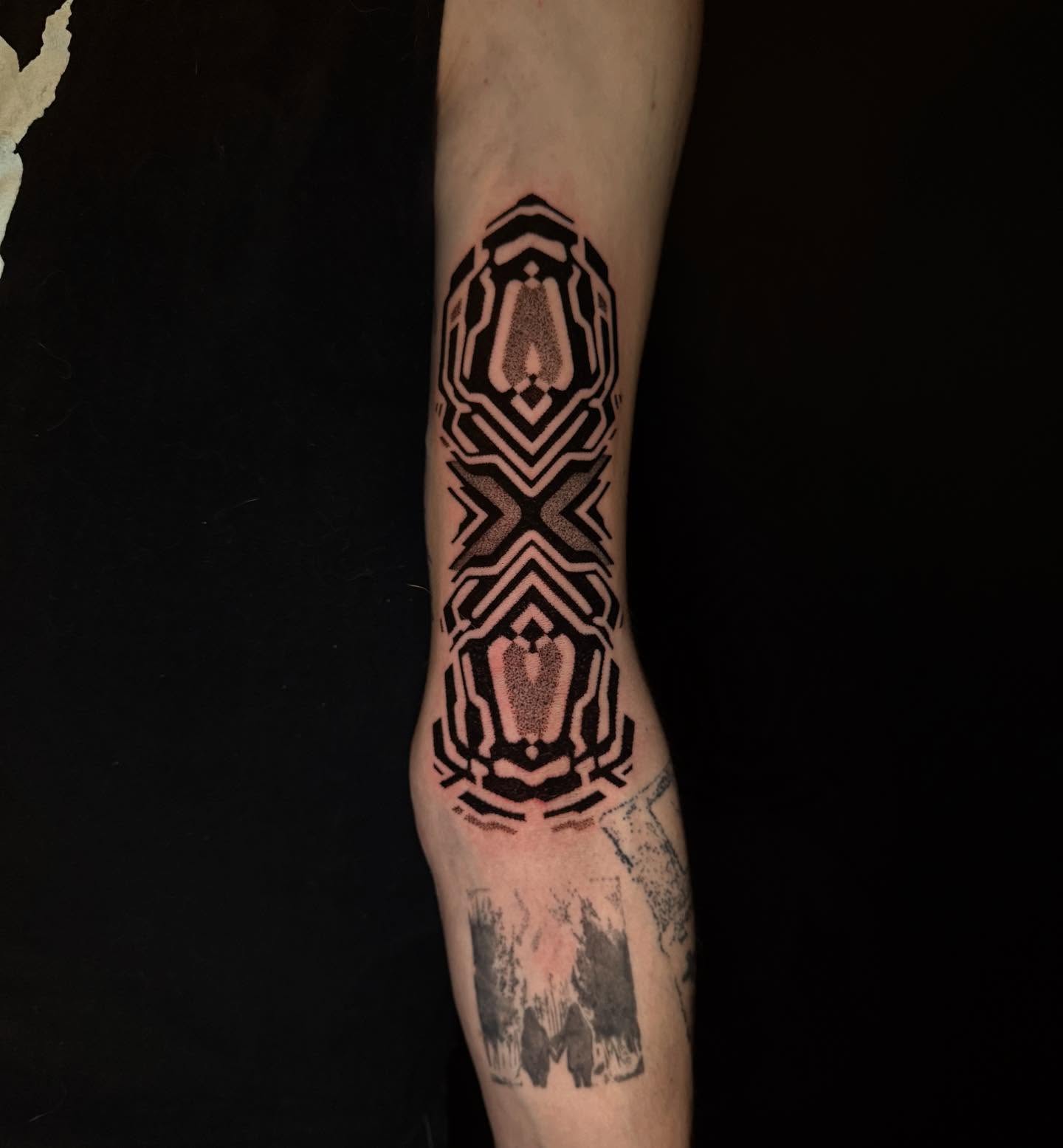 Geometric pattern geometric tattoo on the forearm by Dylan Orbock, Berkeley, California
