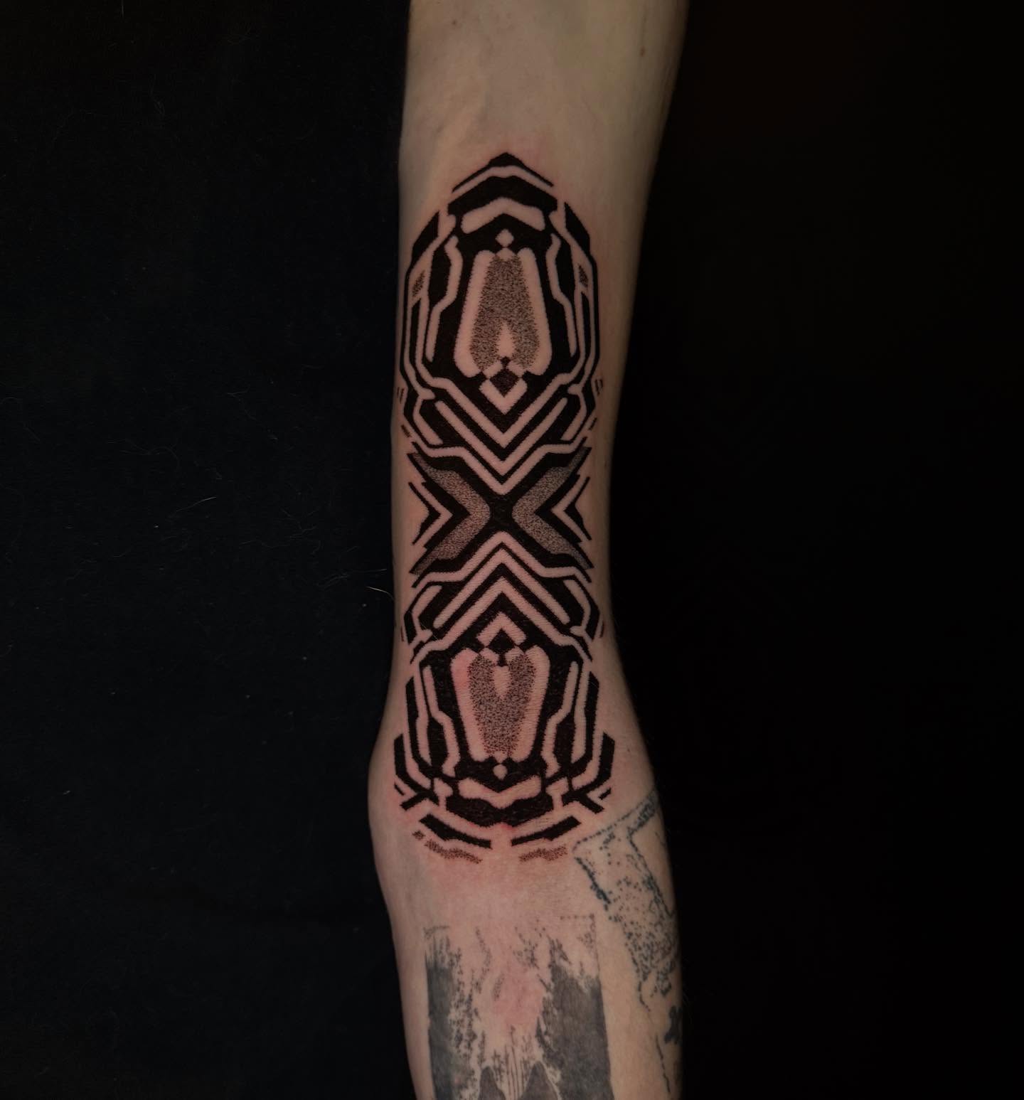 Geometric pattern geometric tattoo on the forearm by Dylan Orbock, Berkeley, California