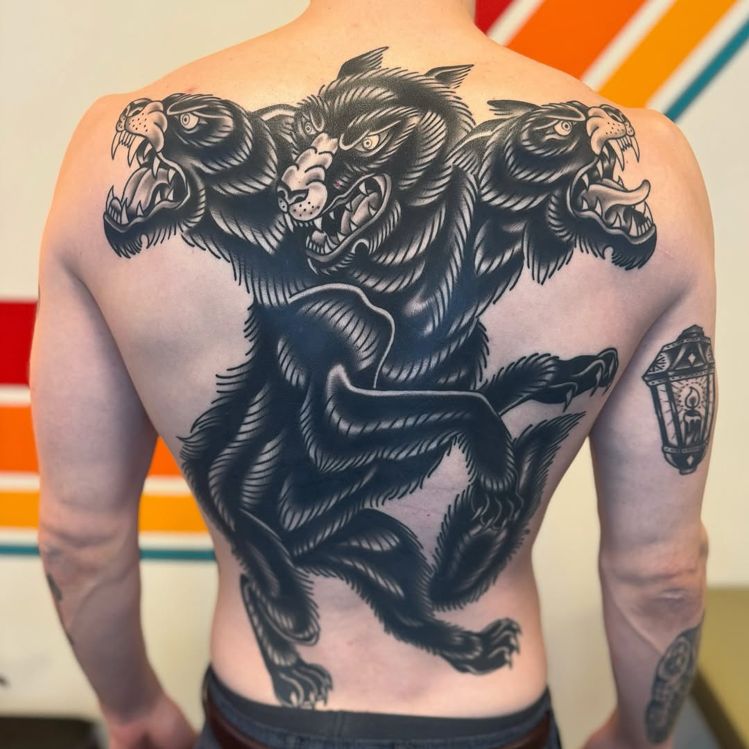 Three-headed wolf realism tattoo on the back by Cori James Tattoo Artist