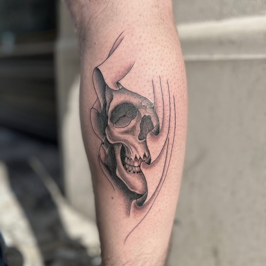 Skull emerging from abstract shapes realism tattoo on the forearm by Tattoo, New York, New York
