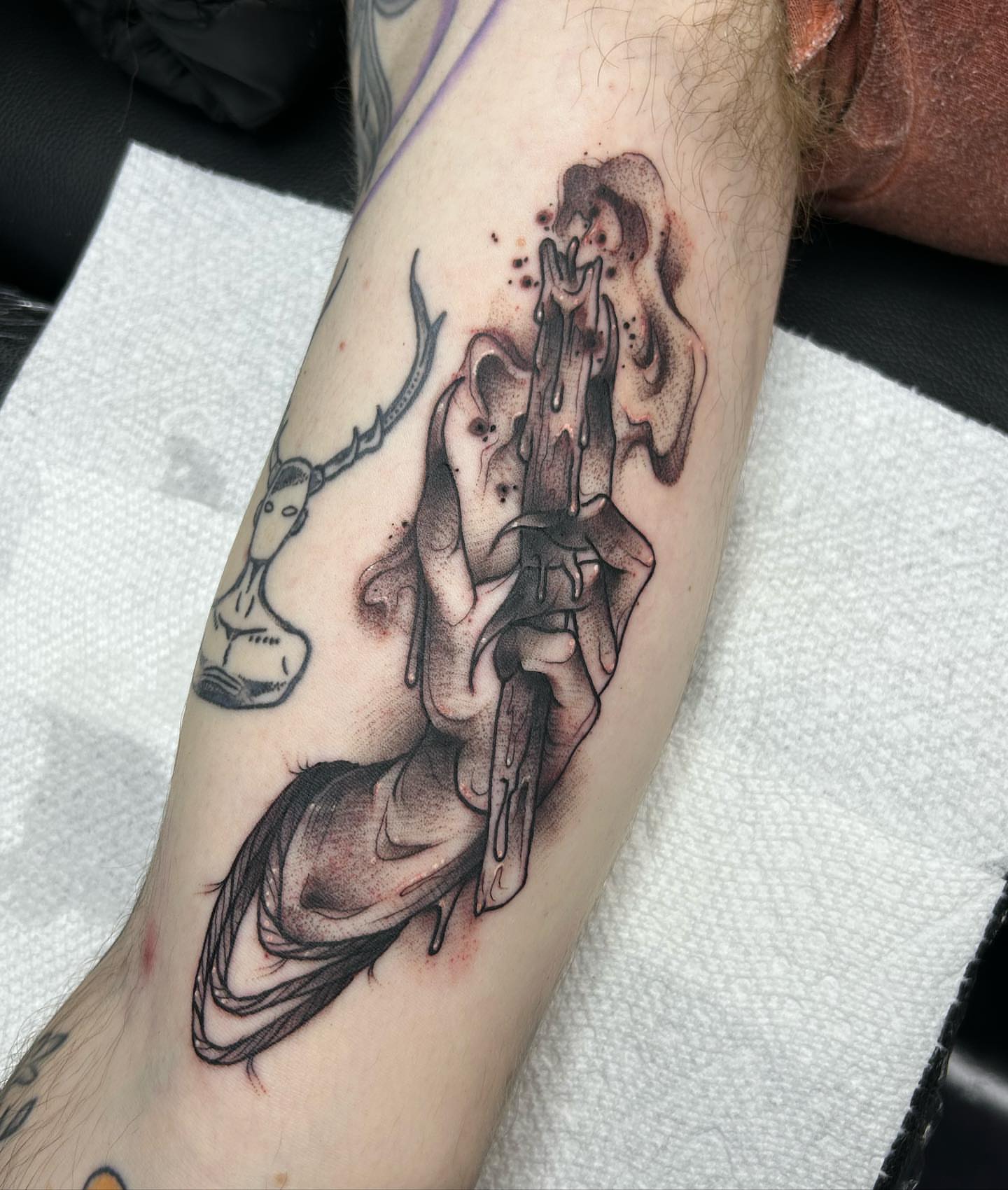 Hourglass and melting candle dotwork tattoo on the forearm by Tatijana., Kettering, Ohio