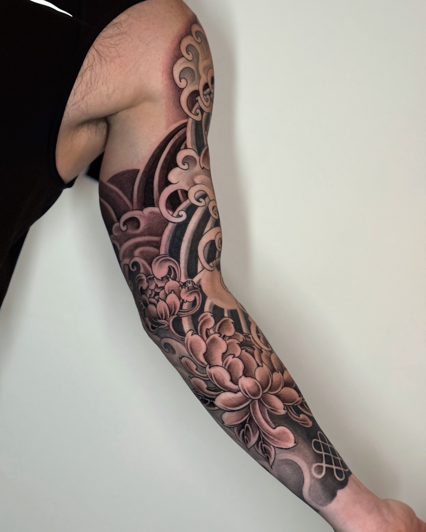 Floral wave japanese irezumi tattoo on the forearm by H O R I H A N