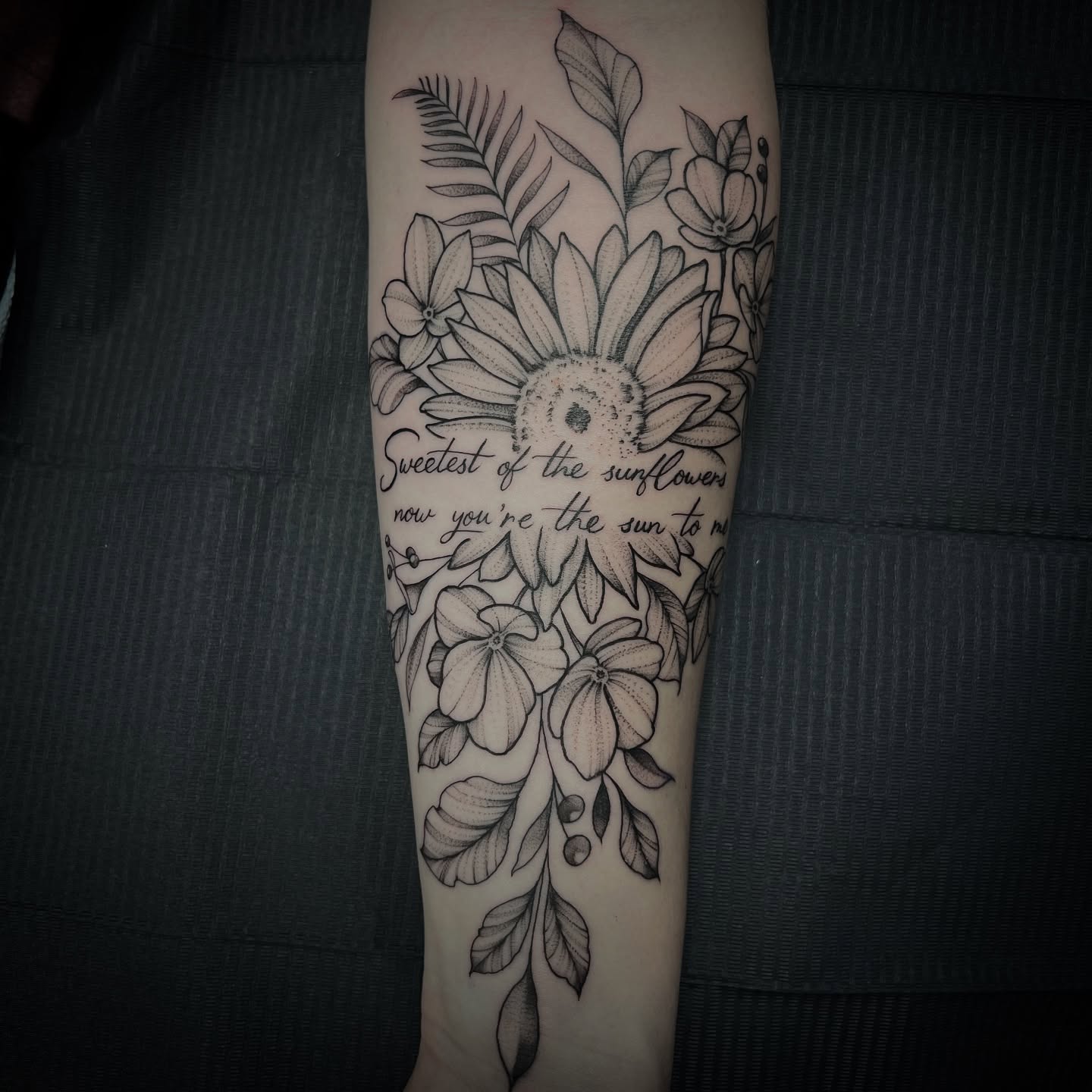 Sunflowers black and grey tattoo on the forearm by Sterling Grice