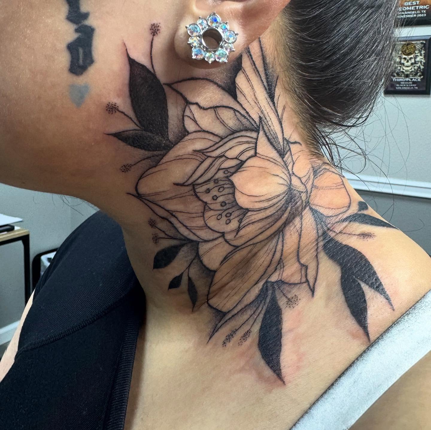 Flower black and grey tattoo on the neck by Mo Dinero🎰