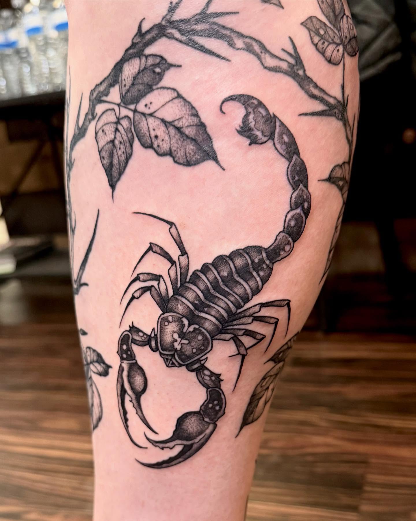 Scorpion black and grey tattoo on the forearm by Katie Stacy
