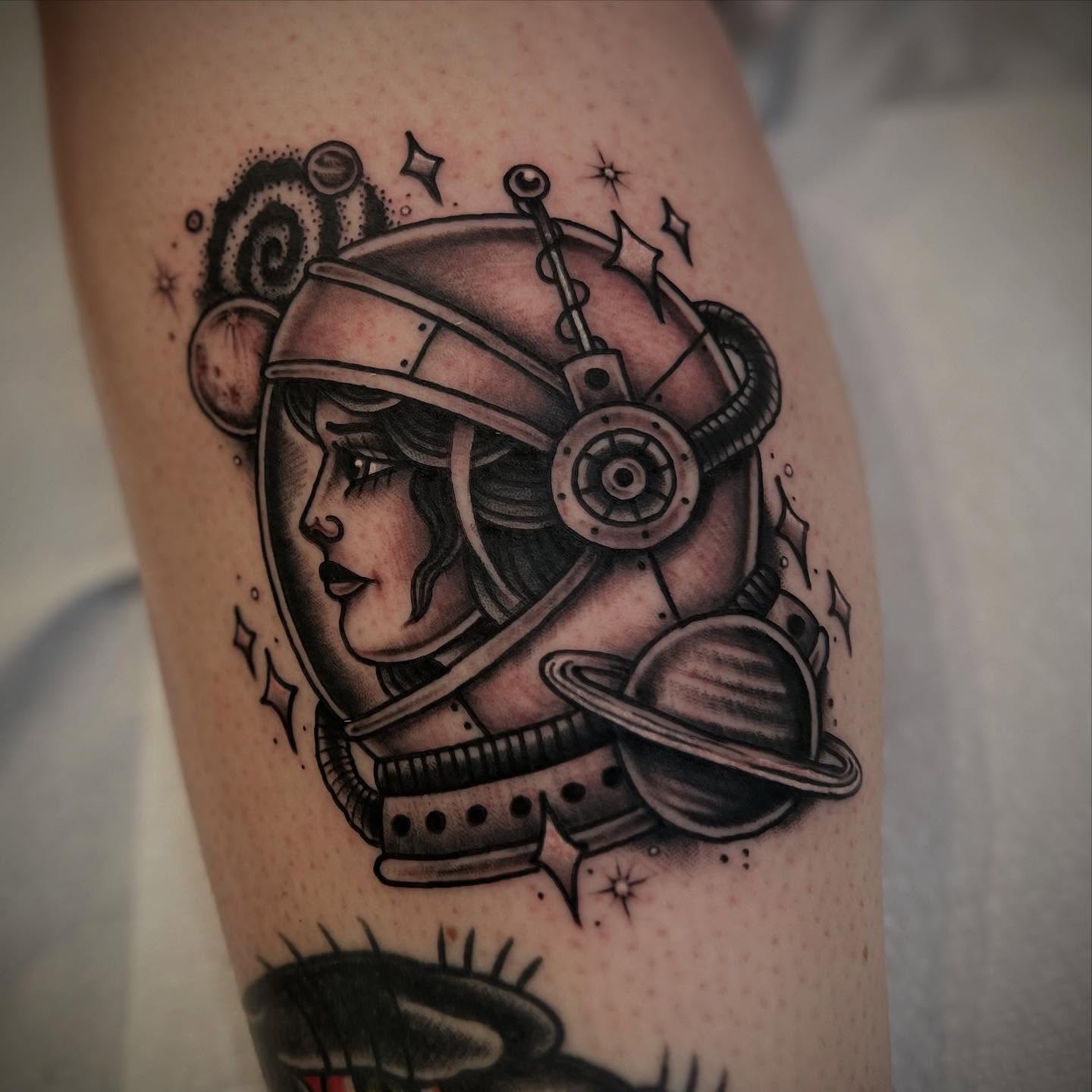 Astronaut girl realism tattoo on the forearm by Chris Romolini